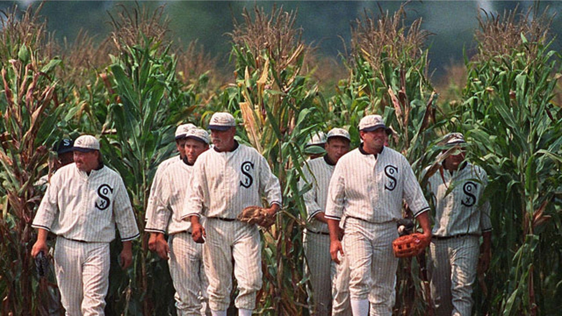 In this June 22, 1997, file photo, Ghost Players emerge from the cornfield at the "Field of Dreams" movie site in Dyersville, Iowa.