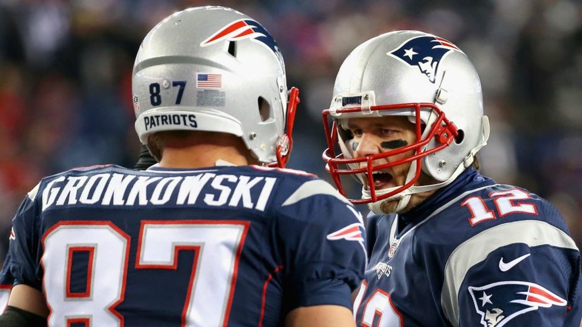 > of the New England Patriots of the Buffalo Bills at Gillette Stadium on November 23, 2015 in Foxboro, Massachusetts.,FOXBORO, MA - NOVEMBER 23: Tom Brady #12 of the New England Patriots reacts with Rob Gronkowski #87 before a game against the Buffalo Bills at Gillette Stadium on November 23, 2015 in Foxboro, Massachusetts. (Photo by Jim Rogash/Getty Images)