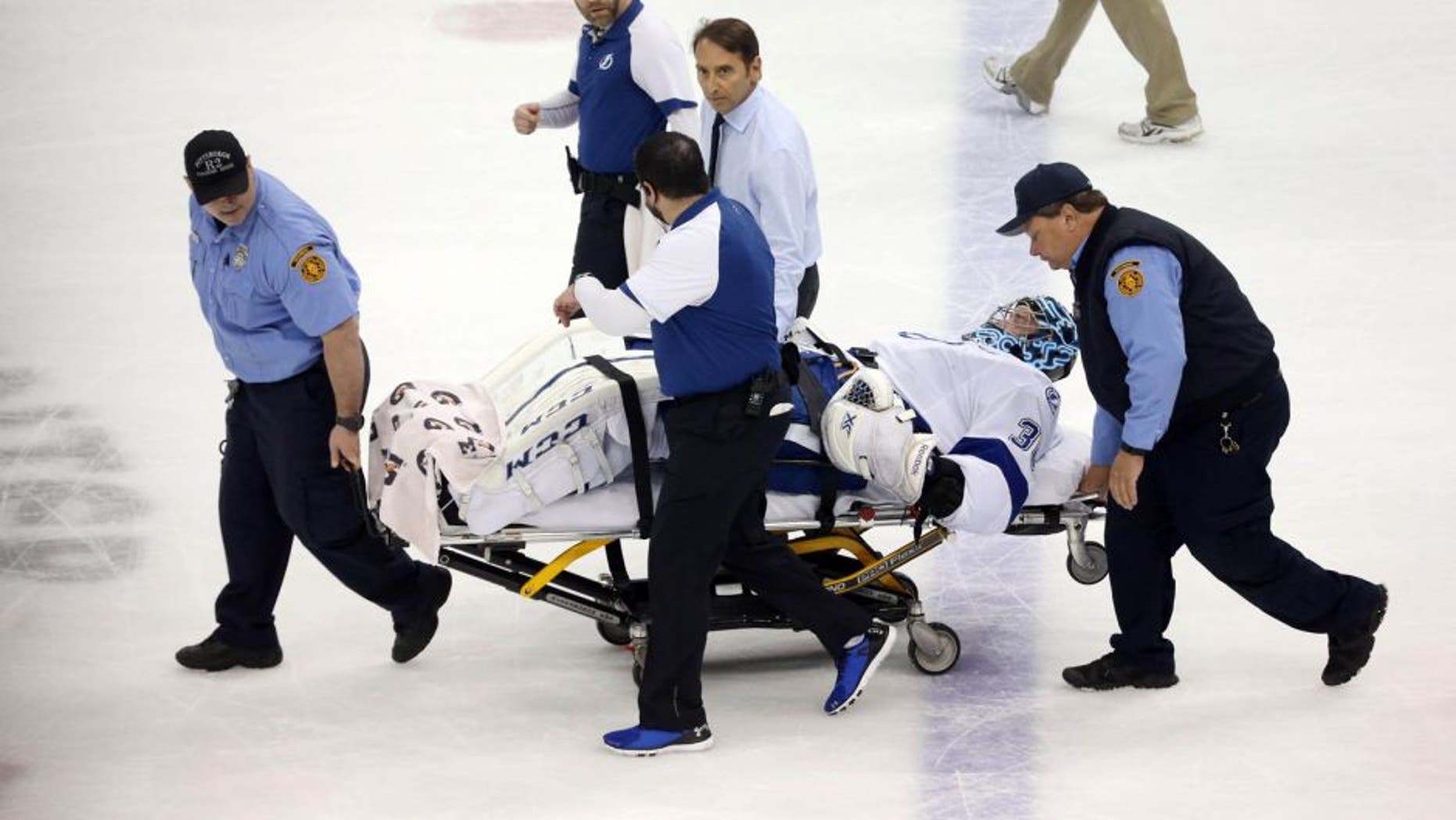 May 13, 2016; Pittsburgh, PA, USA; Tampa Bay Lightning goalie Ben Bishop (30) is taken from the ice on a stretcher after suffering an apparent injury against the Pittsburgh Penguins during the first period in game one of the Eastern Conference Final of the 2016 Stanley Cup Playoffs at the CONSOL Energy Center. Mandatory Credit: Charles LeClaire-USA TODAY Sports