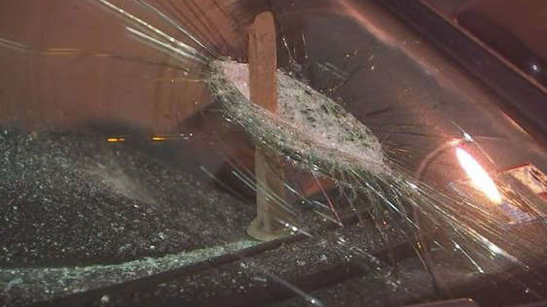 Photo shows spike going through windshield.