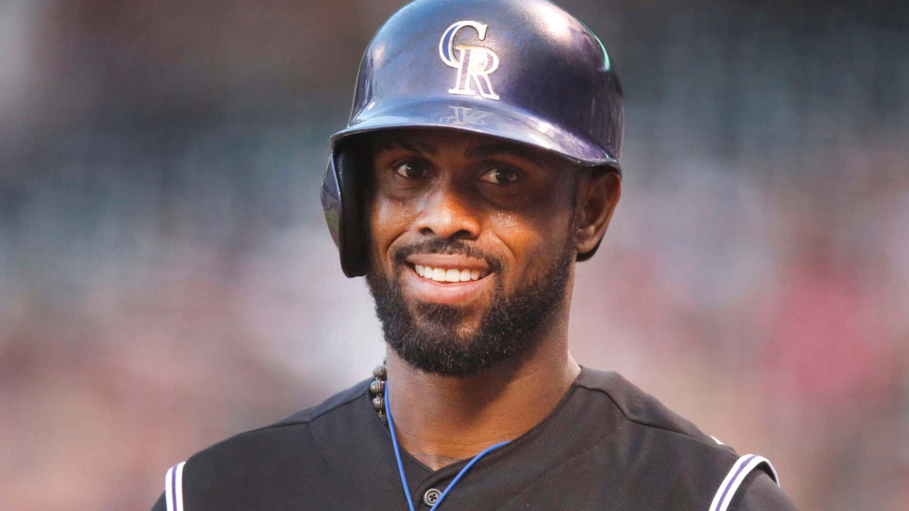 FILE - In this Aug. 21, 2015, file photo, Colorado Rockies shortstop Jose Reyes is seen in the first inning of a baseball game in Denver.