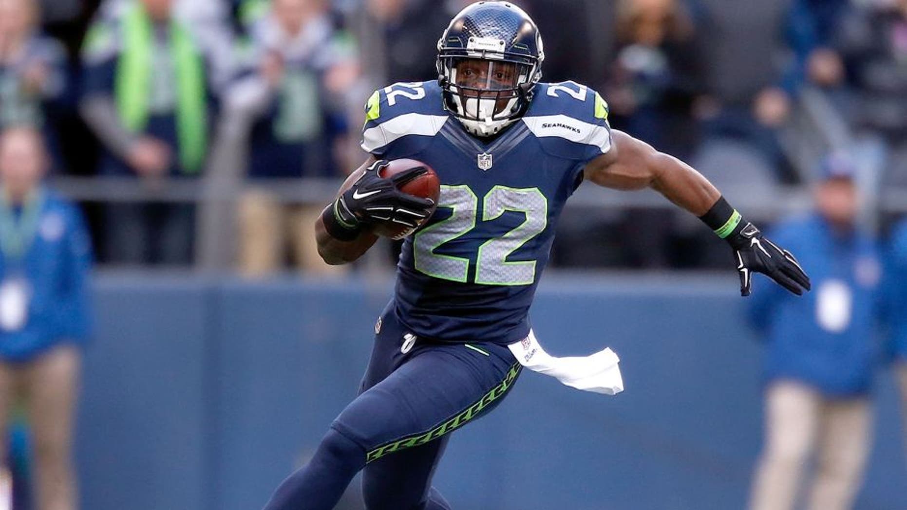 SEATTLE, WA - DECEMBER 28: Running back Robert Turbin #22 of the Seattle Seahawks runs with the ball during the second quarter of the game against the St. Louis Rams at CenturyLink Field on December 28, 2014 in Seattle, Washington. (Photo by Otto Greule Jr/Getty Images)