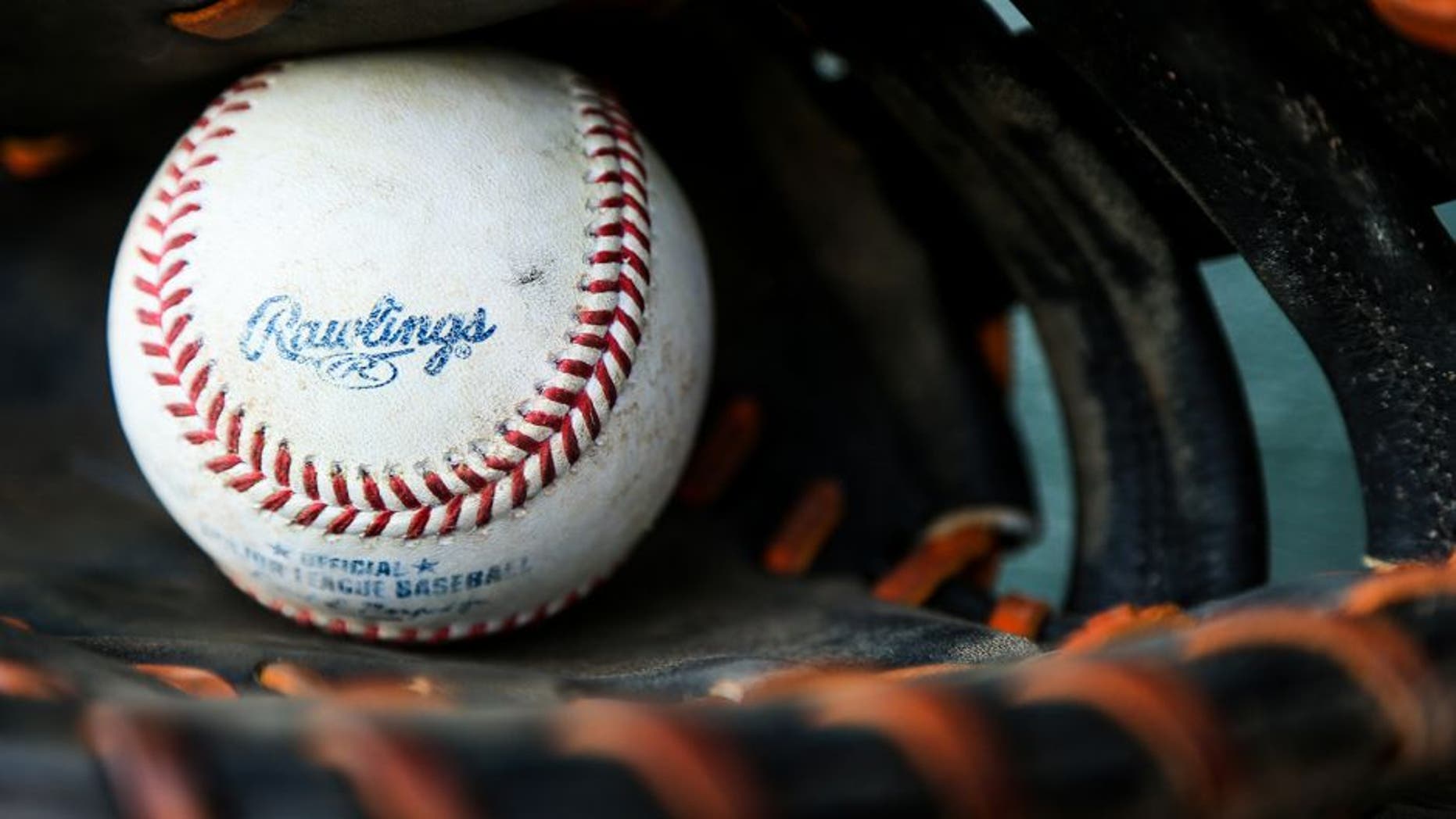 JUPITER, FL - MARCH 15: A detailed view of a Rawlings baseball sitting inside of a glove before the spring training game between the Miami Marlins and the New York Mets on March 15, 2016 in Jupiter, Florida. (Photo by Rob Foldy/Getty Images)