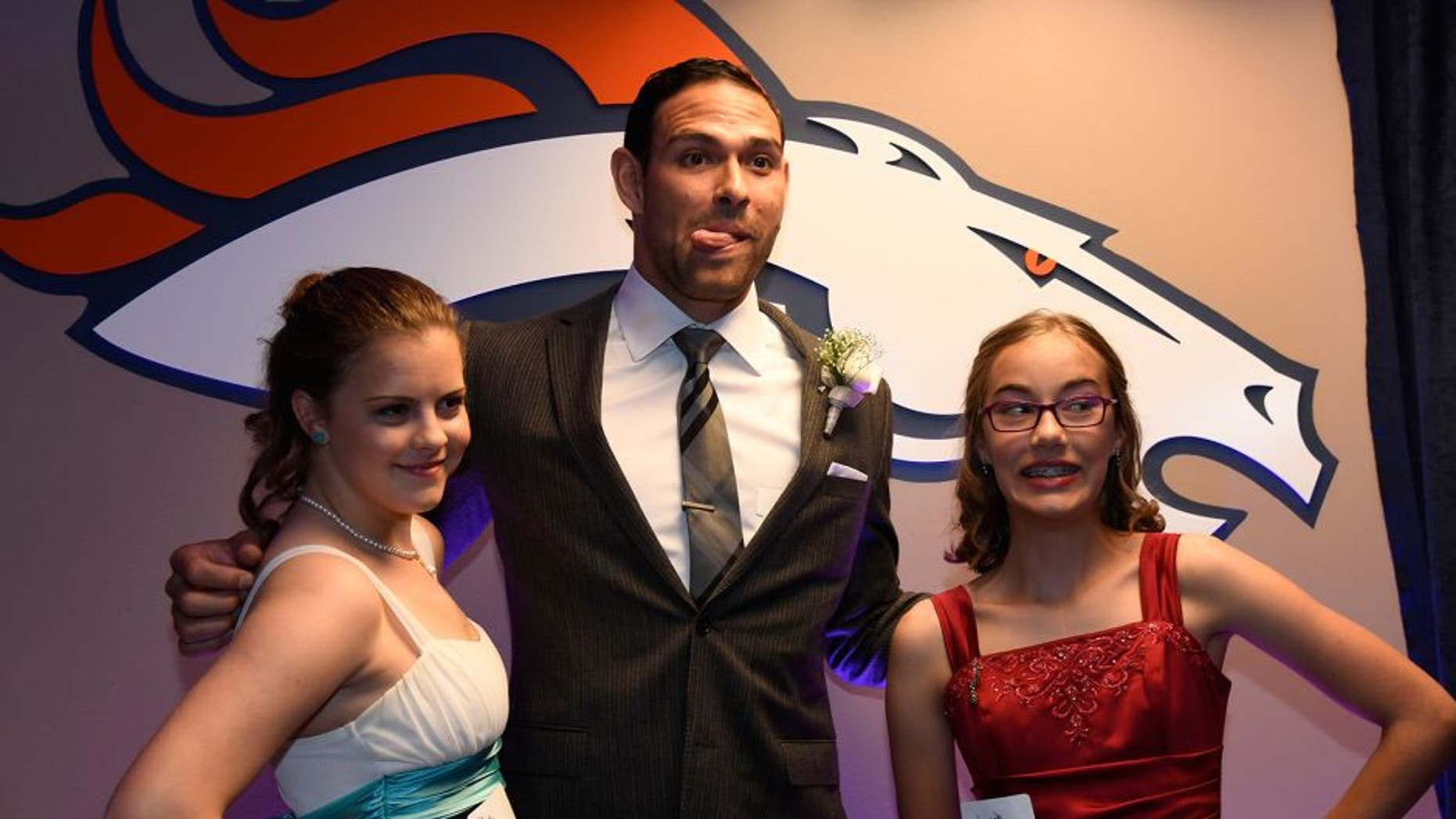 DENVER, CO - MAY 13: Denver Broncos quarterback Mark Sanchez poses for a photo during a Night of Champions prom. Teens got their makeup, hair and nails done before prom night May 13, 2016 at Sports Authority Field at Mile High. Some of the teens missed their own prom due to illness and just couldn't attend. Childrens Hospital hosted the Night of Champions gala. (Photo By John Leyba/The Denver Post via Getty Images)