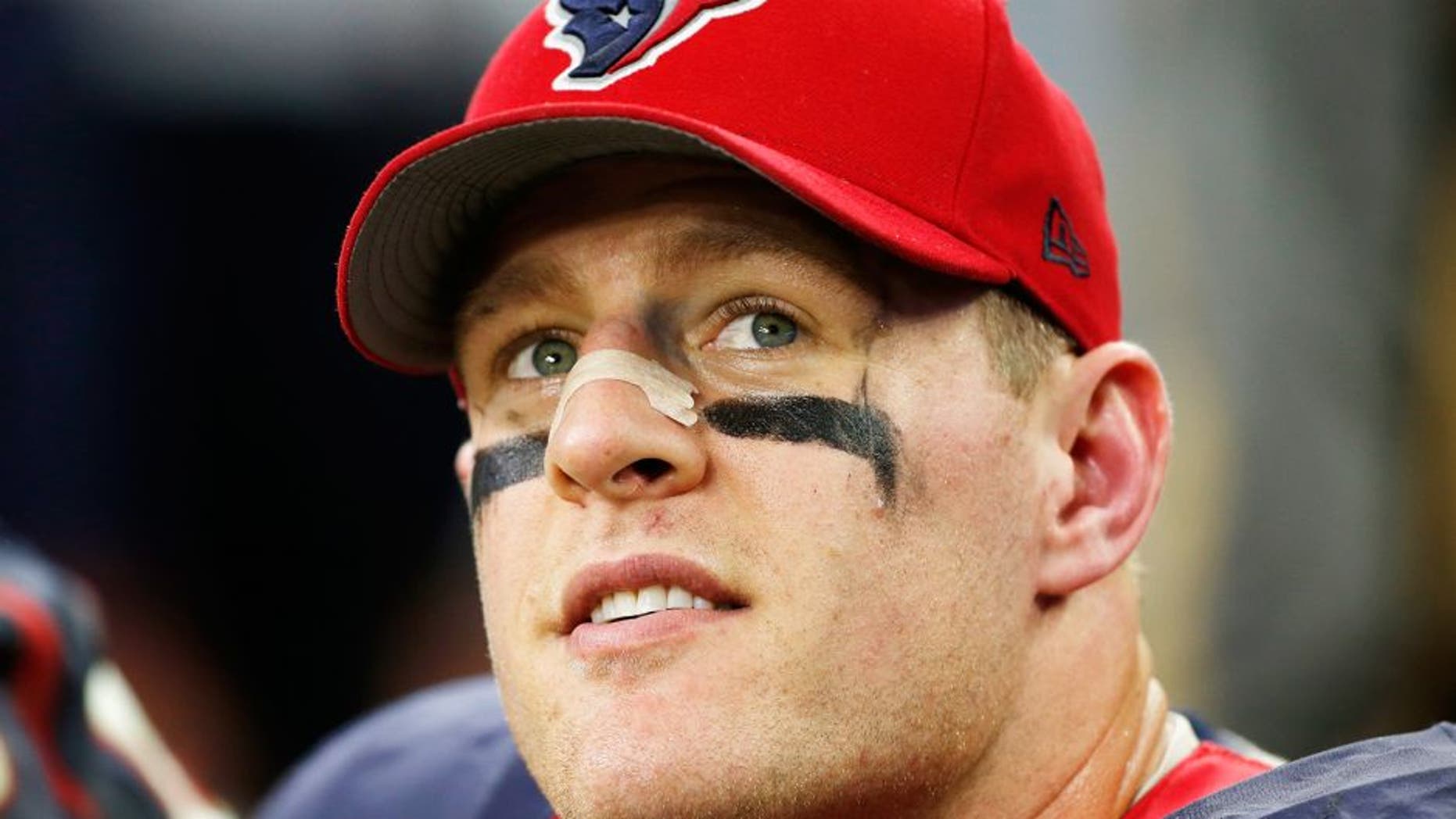 HOUSTON, TX - DECEMBER 28: J.J. Watt #99 of the Houston Texans sits on the bench late in their game against the Jacksonville Jaguars at NRG Stadium on December 28, 2014 in Houston, Texas. (Photo by Scott Halleran/Getty Images)