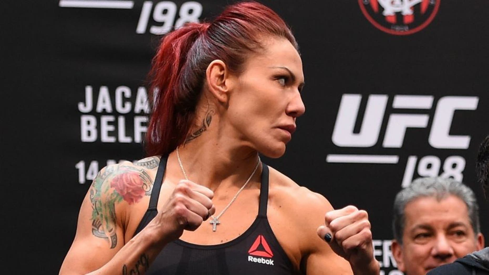 CURITIBA, BRAZIL - MAY 13: (L-R) Opponents Cristiane 'Cyborg' Justino of Brazil and Leslie Smith face off during the UFC 198 weigh-in at Arena da Baixada stadium on May 13, 2016 in Curitiba, Parana, Brazil. (Photo by Josh Hedges/Zuffa LLC/Zuffa LLC via Getty Images)