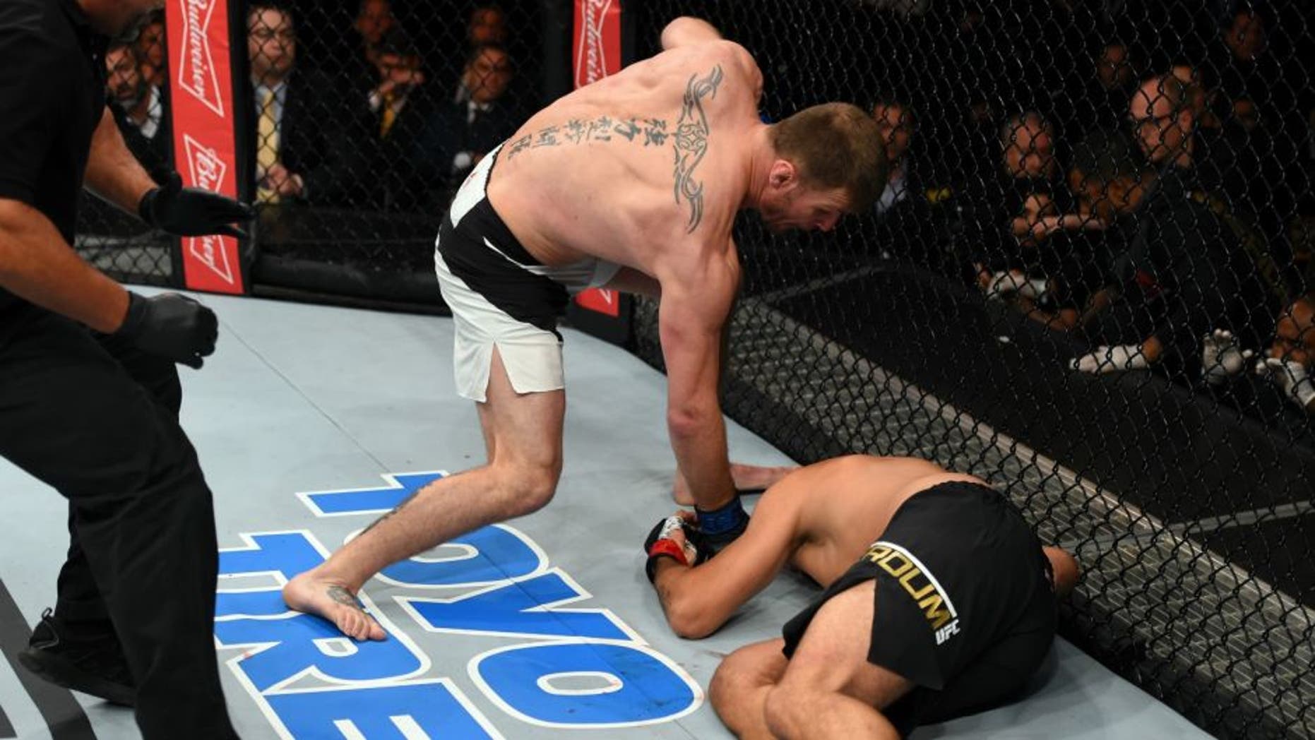 CURITIBA, BRAZIL - MAY 14: (L-R) Stipe Miocic punches Fabricio Werdum of Brazil in their UFC heavyweight championship bout during the UFC 198 event at Arena da Baixada stadium on May 14, 2016 in Curitiba, Parana, Brazil. (Photo by Josh Hedges/Zuffa LLC/Zuffa LLC via Getty Images)