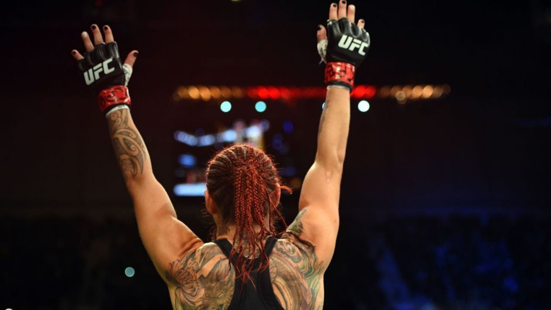 CURITIBA, BRAZIL - MAY 14: Cristiane 'Cyborg' Justino of Brazil celebrates after defeating Leslie Smith in their women's catchweight bout during the UFC 198 event at Arena da Baixada stadium on May 14, 2016 in Curitiba, Parana, Brazil. (Photo by Josh Hedges/Zuffa LLC/Zuffa LLC via Getty Images)