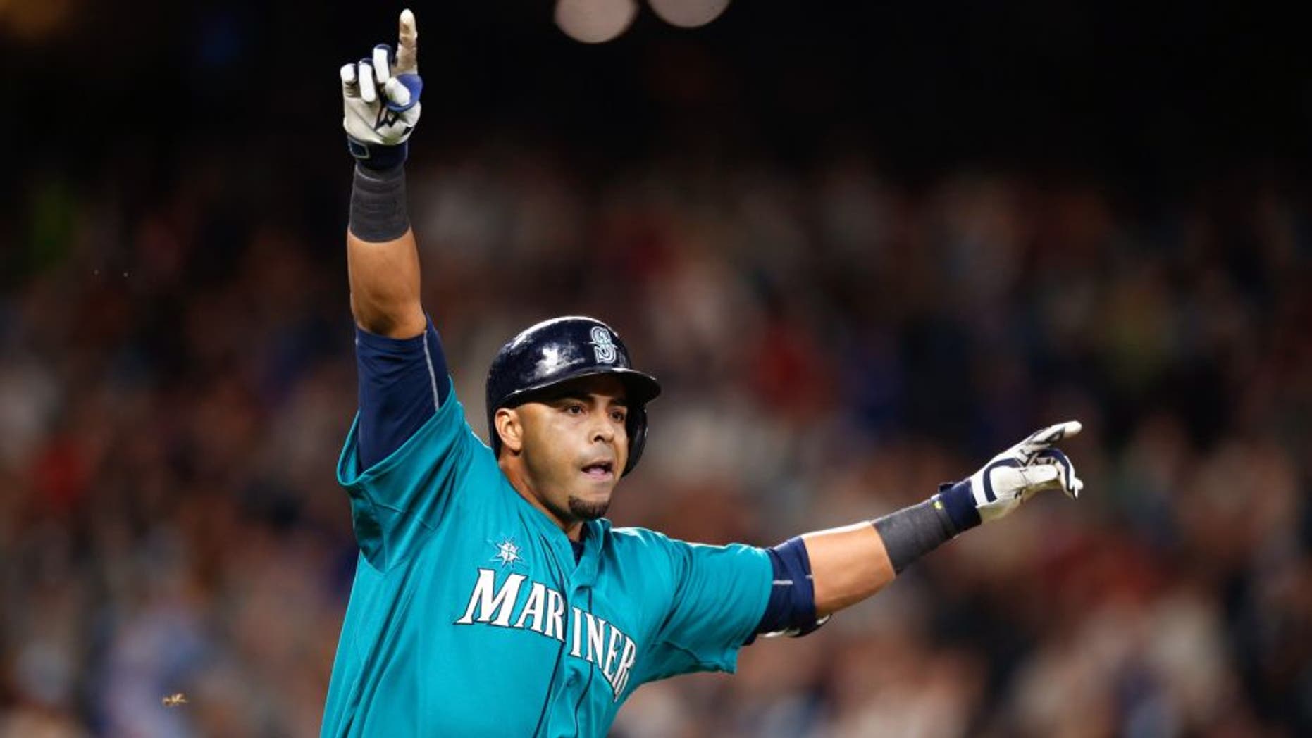 SEATTLE, WA - MAY 15: Nelson Cruz #23 of the Seattle Mariners celebrates after hitting a walkoff single to defeat the Boston Red Sox 2-1 at Safeco Field on May 15, 2015 in Seattle, Washington. (Photo by Otto Greule Jr/Getty Images)