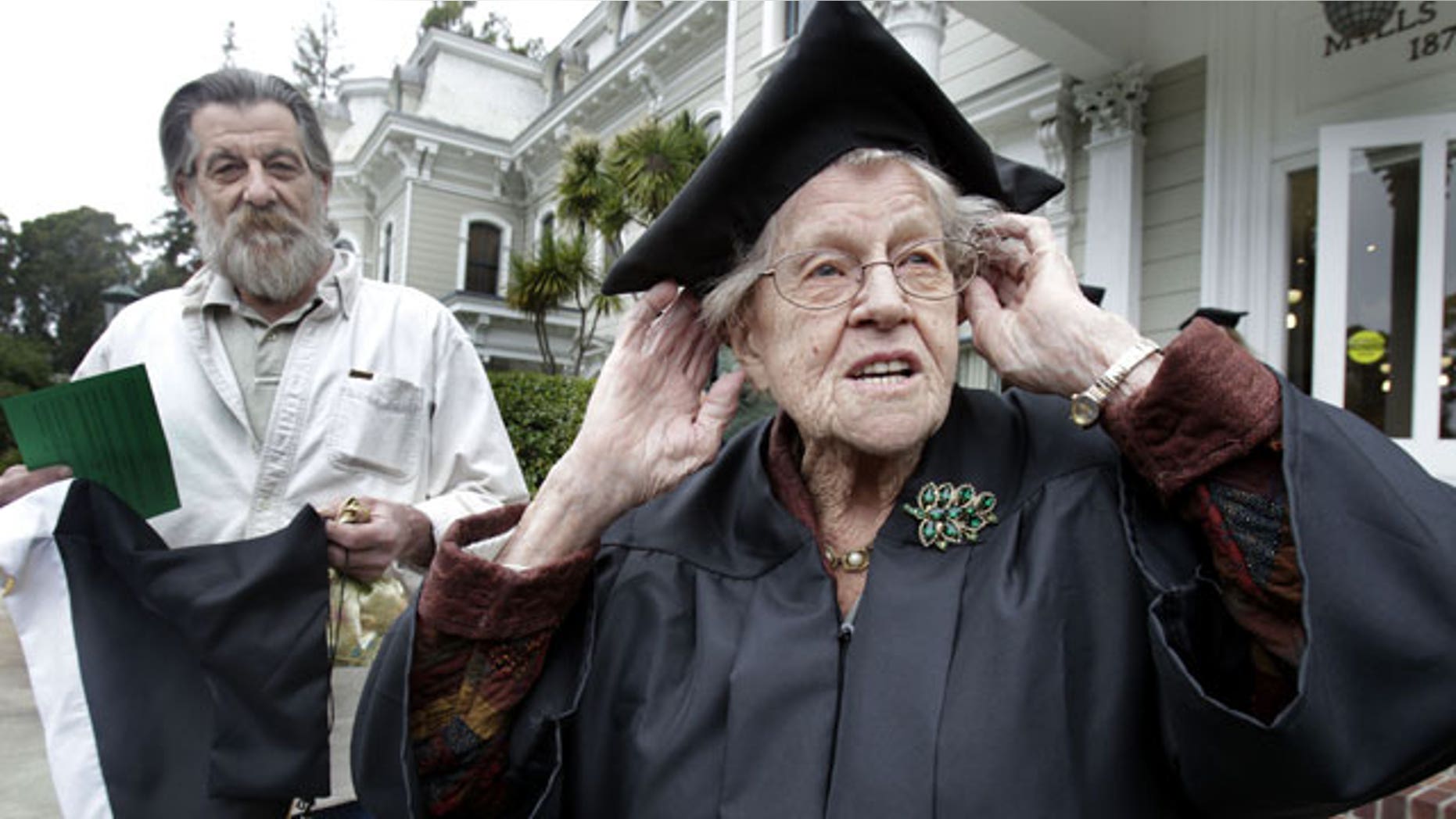 May 15: Hazel Soares, 94, right, gets ready before the start of commencement exercises at Mills College, as her son Matthew Soares, 59, looks on in Oakland, Calif.
