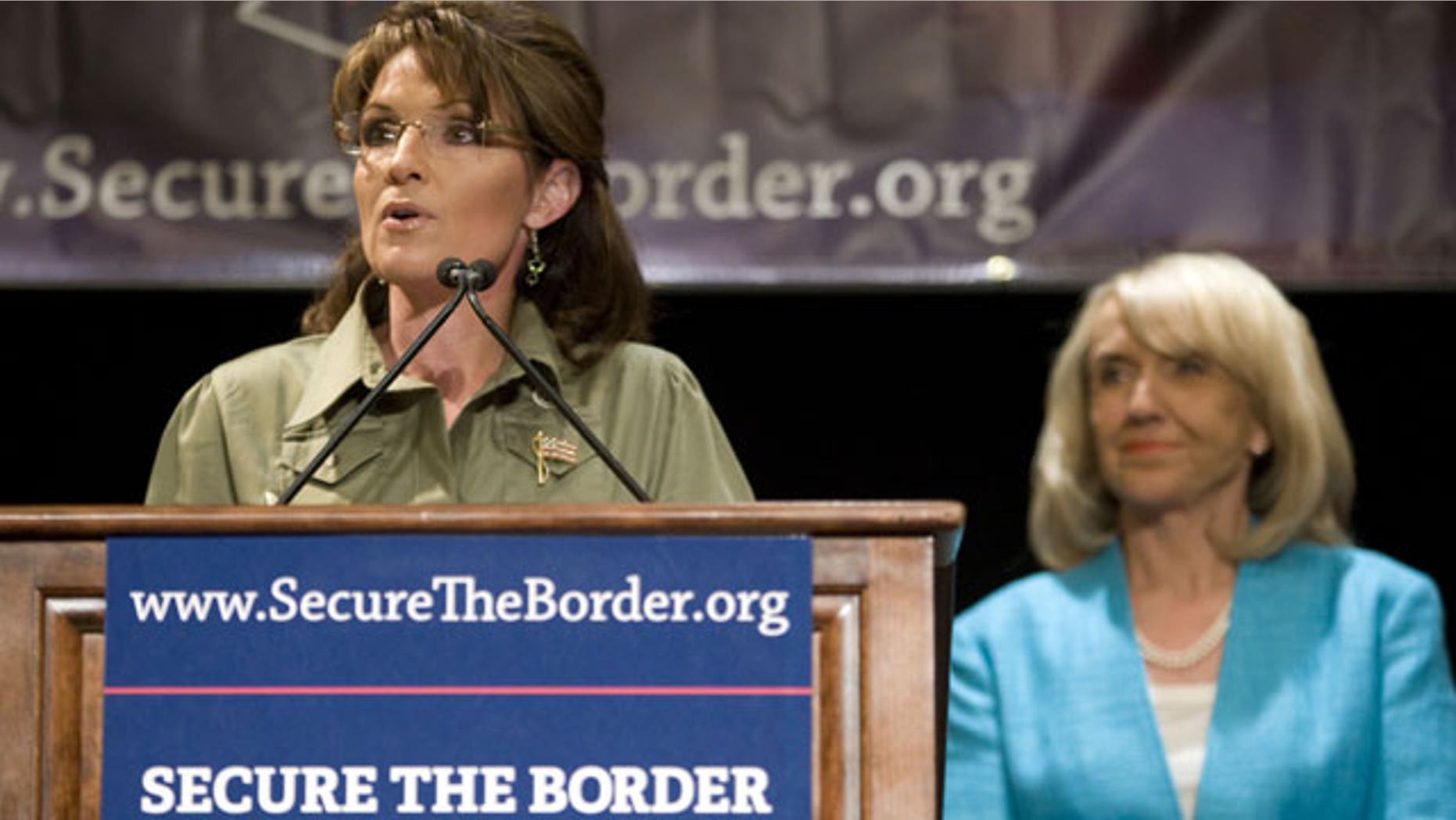 May 15: Former Alaska Governor Sarah Palin, left, speaks as Arizona Gov. Jan Brewer looks on at a news conference about border security at the JW Marriott Desert Ridge in Phoenix.