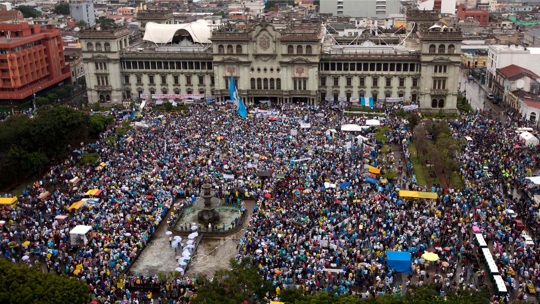 May 16, 2015: Protesters gather outside the National Palace to demand the resignation of Guatemalan President Otto Perez Molina in Guatemala City.