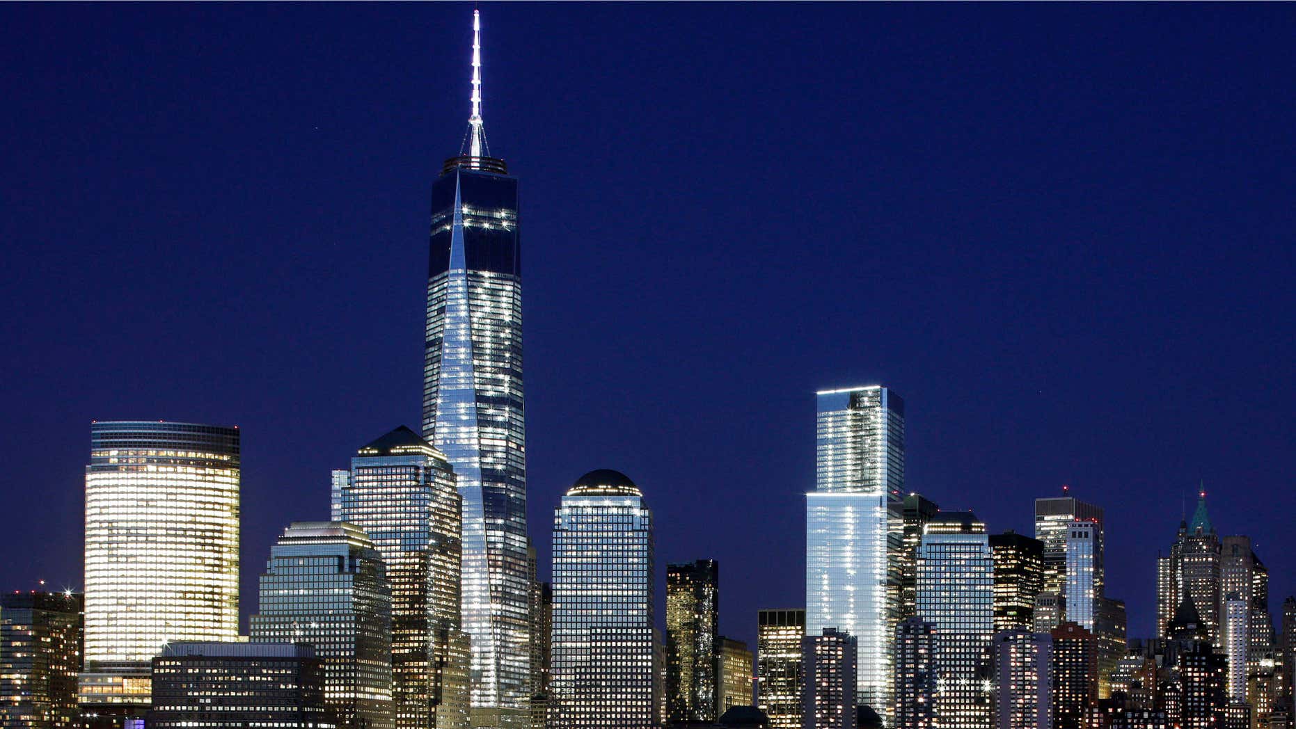 May 6, 2015: A mostly illuminated One World Trade Center towers over the lower Manhattan skyline in New York.