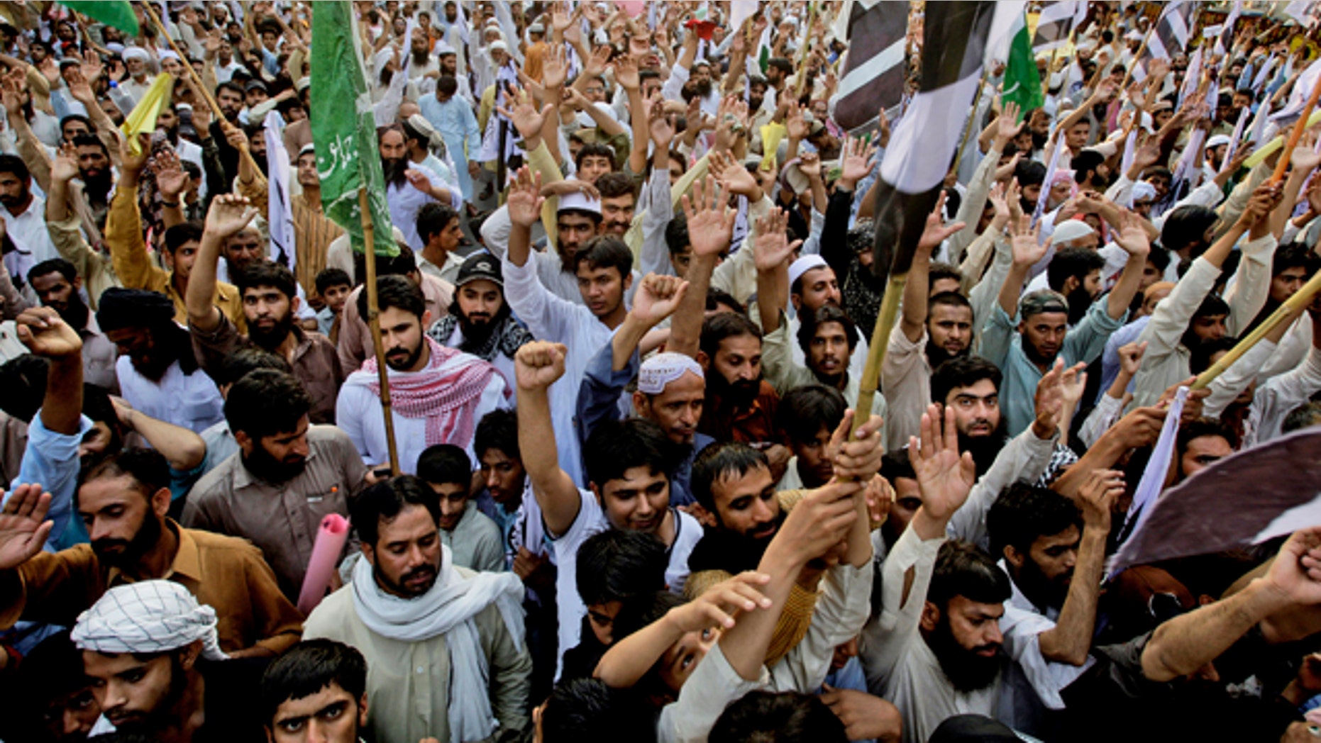 Supporters of Pakistani religious group Jamaat-ud-Dawa, rally to condemn the United States for the killing of Al Qaeda leader Usama bin Laden, in Lahore, Pakistan.