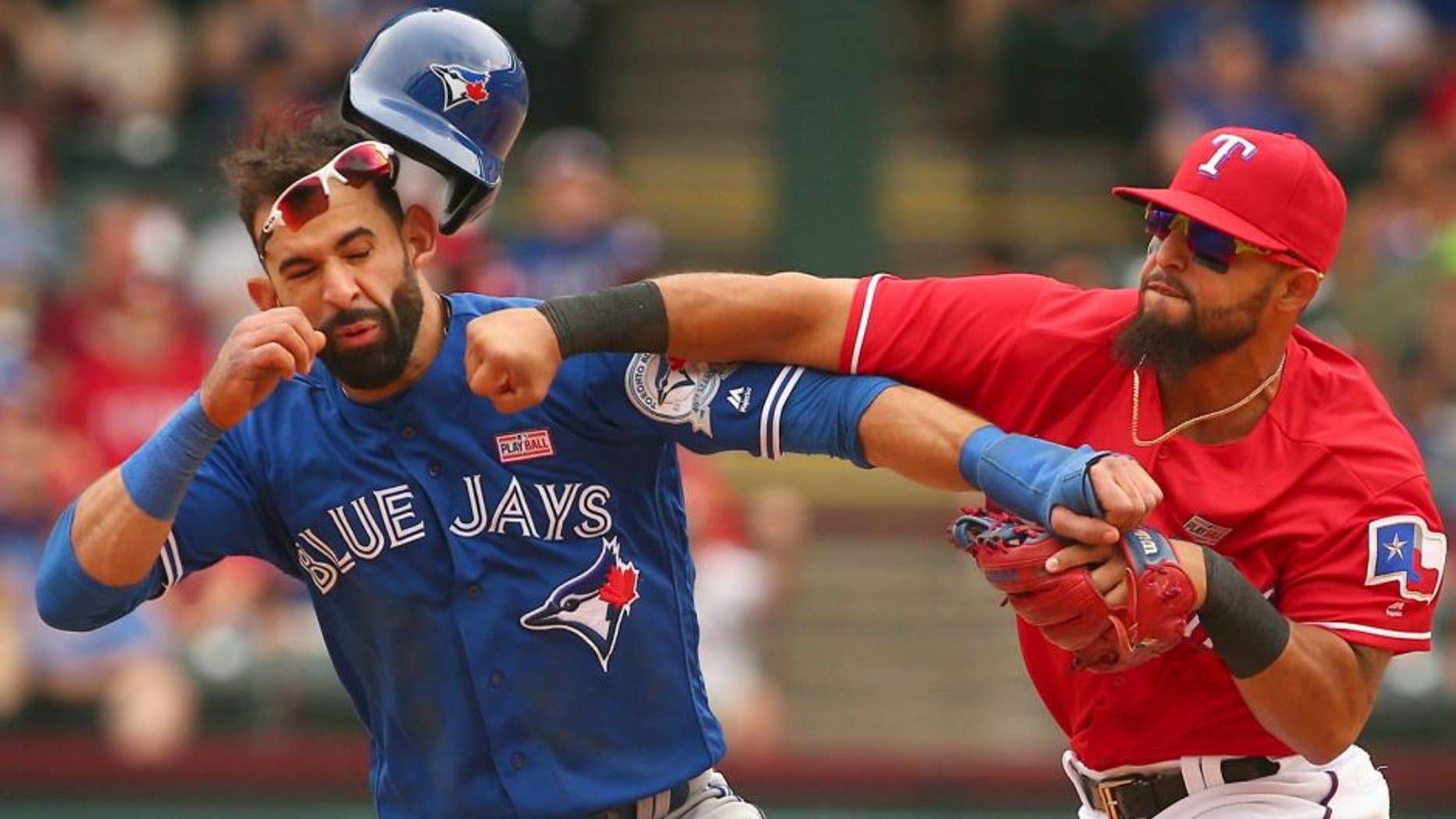 Toronto Blue Jays Jose Bautista (19) gets hit by Texas Rangers second baseman Rougned Odor (12) after Bautista slid into second in the 8th inning at Globe Life Park on May 15, 2016 in Arlington, Texas. The Rangers won 7-6. (Richard W. Rodriguez/Fort Worth Star-Telegram/TNS),Toronto Blue Jays Jose Bautista (19) gets hit by Texas Rangers second baseman Rougned Odor (12) after Bautista slid into second in the 8th inning at Globe Life Park on May 15, 2016 in Arlington, Texas. The Rangers won 7-6. (Richard W. Rodriguez/Fort Worth Star-Telegram/TNS via Getty Images)
