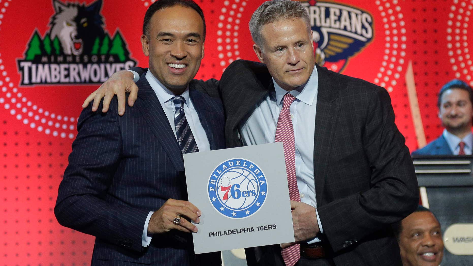NBA deputy commissioner Mark Tatum, left, poses for a photo with Philadelphia 76ers head coach Brett Brown during the NBA basketball draft lottery, Tuesday, May 17, 2016, in New York.