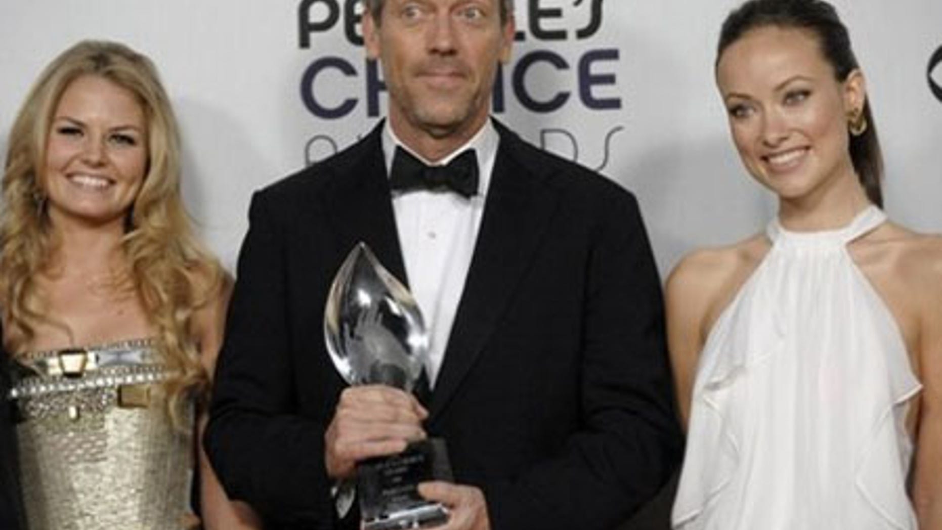 From left, Jennifer Morrison, Hugh Laurie and Olivia Wilde pose backstage with the favorite TV drama award for "House" at the 35th Annual People's Choice Awards on Wednesday Jan. 7, 2009 in Los Angeles. (AP Photo/Chris Pizzello)