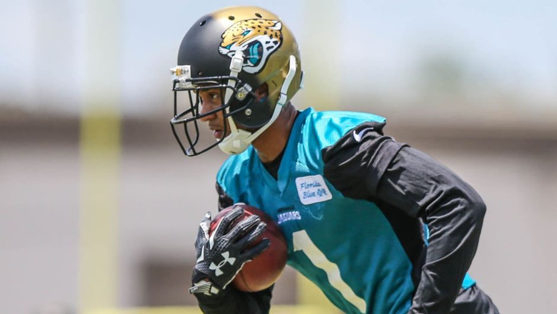 Jacksonville Jaguars wide receiver Rashad Greene (1) carries the ball during drills at NFL football rookie camp Saturday, May 9, 2015, in Jacksonville, Fla. (AP Photo/Gary McCullough)