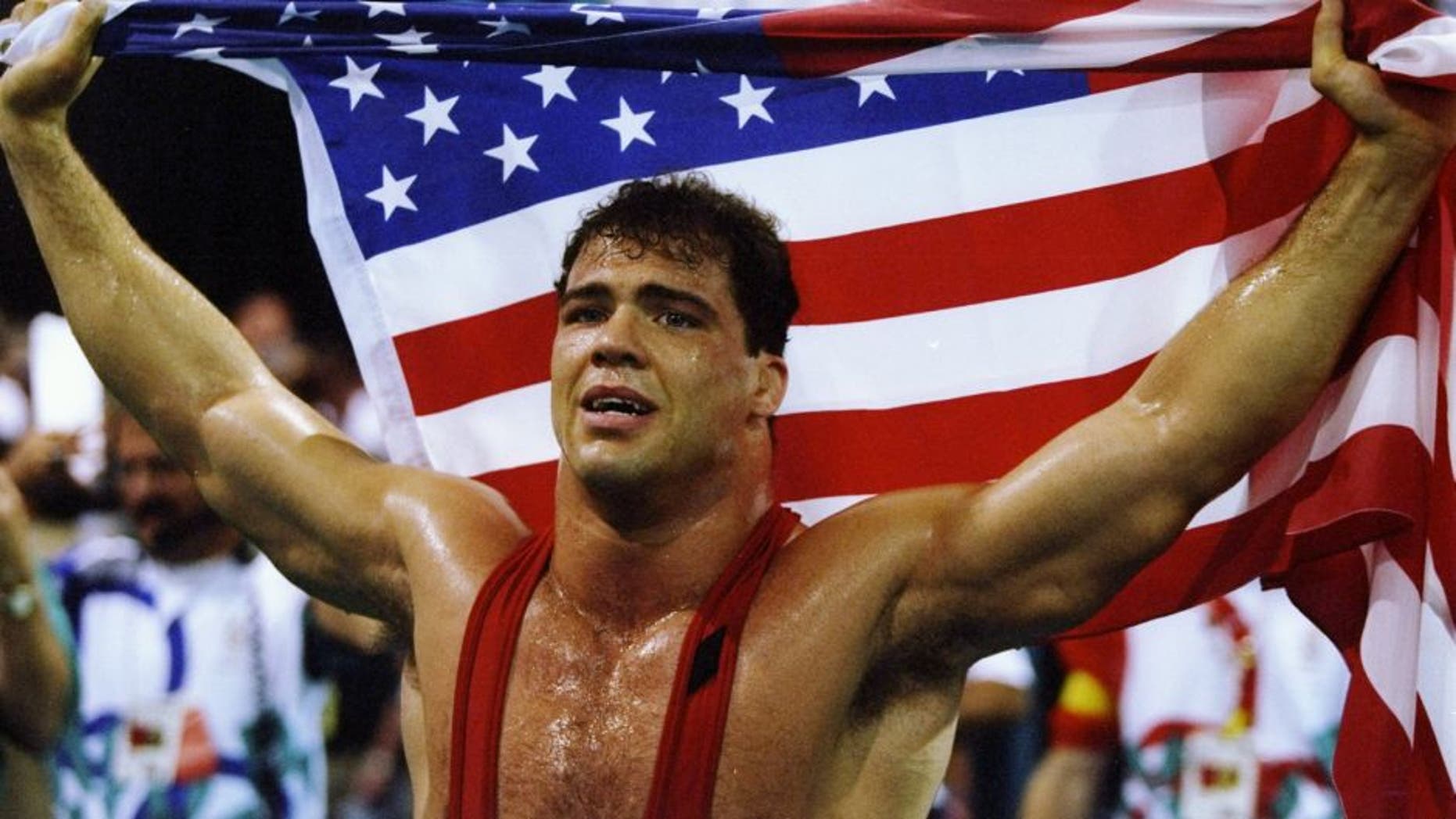 31 Jul 1996: Kurt Angle of the United States holds the American flag at the free-style wrestling competition during the Summer Olympics at the Georgia World Congress Center in Atlanta, Georgia.