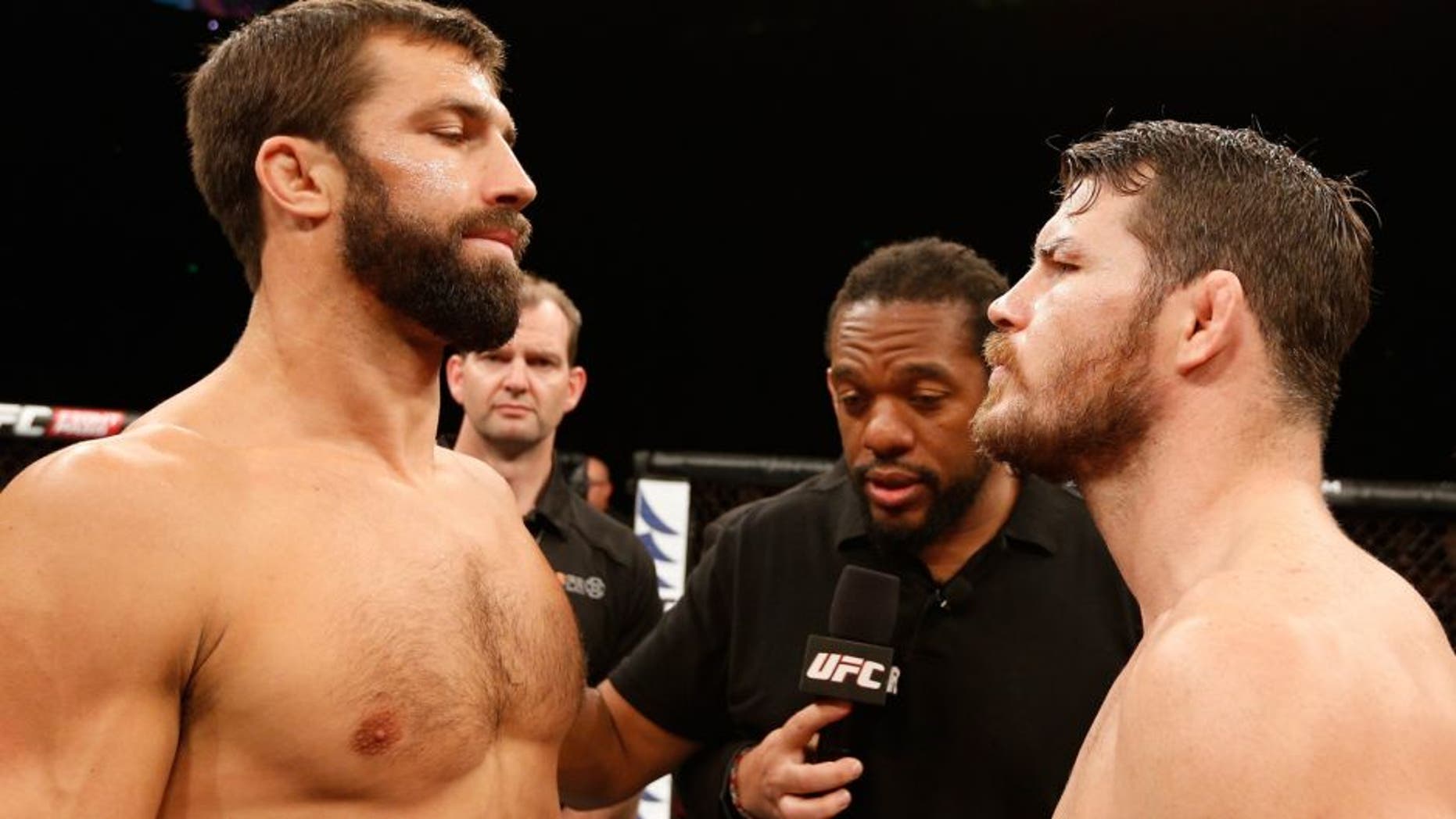 SYDNEY, NSW - NOVEMBER 08: (L-R) Opponents Luke Rockhold of the United States and Michael Bisping of England face off before their middleweight bout during the UFC Fight Night event inside Allphones Arena on November 8, 2014 in Sydney, Australia. (Photo by Josh Hedges/Zuffa LLC/Zuffa LLC via Getty Images)