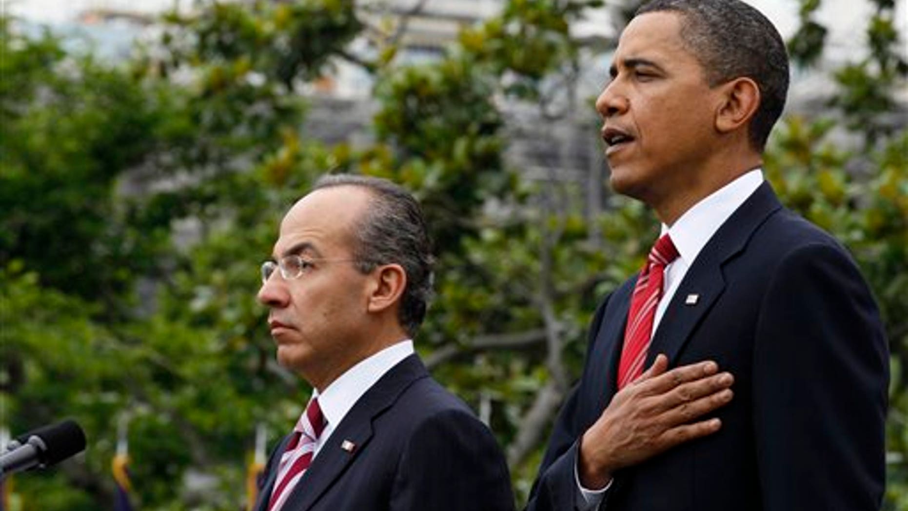 President Obama stands with Mexican President Felipe Calderon during the playing of the American National Anthem, on the South Lawn of the White House in Washington, Wednesday, May 19, 2010. President Calderon will be attending a state dinner at the White House with President Obama later in the evening (AP).