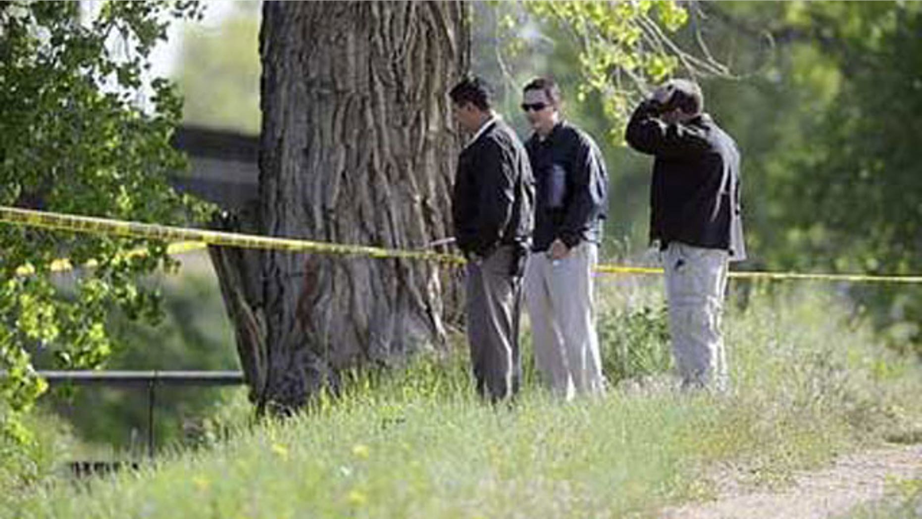 May 19: Police investigate the scene where a body was found in west Greeley, Colo.