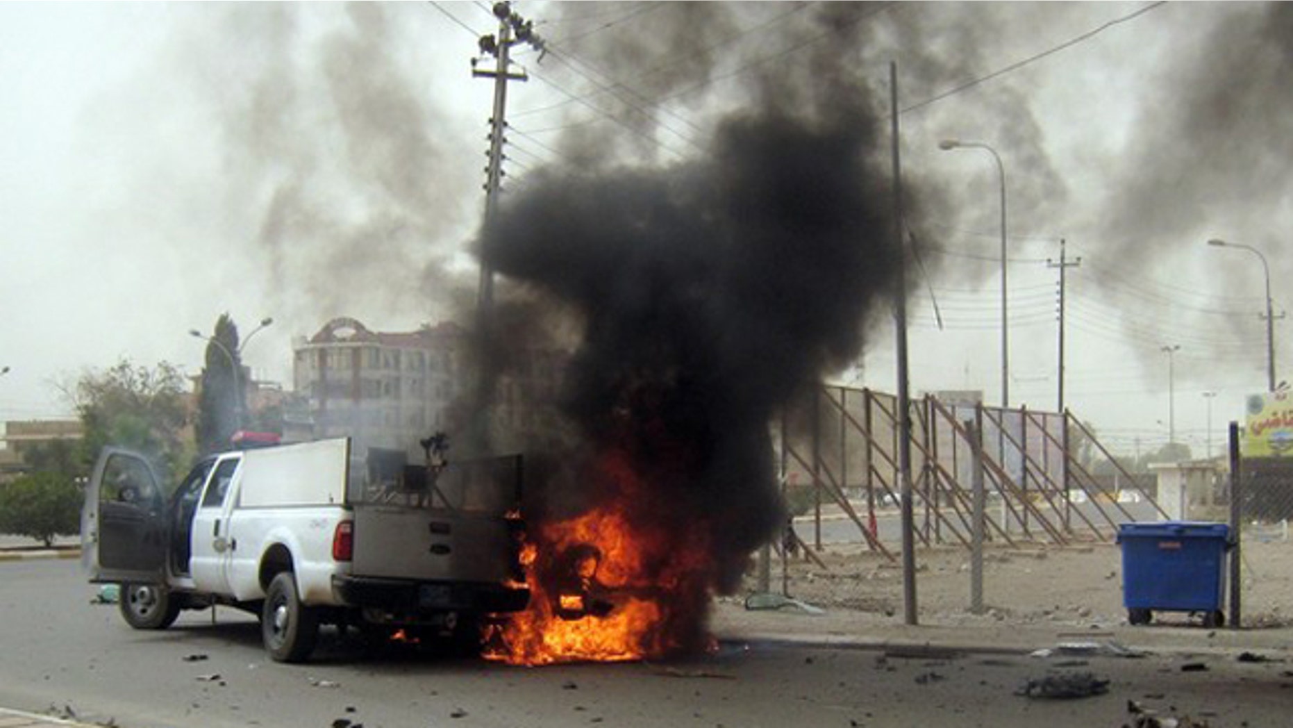 May 19: A car burns following a bomb attack in the northern oil-rich city of Kirkuk, killing at least 27 people.