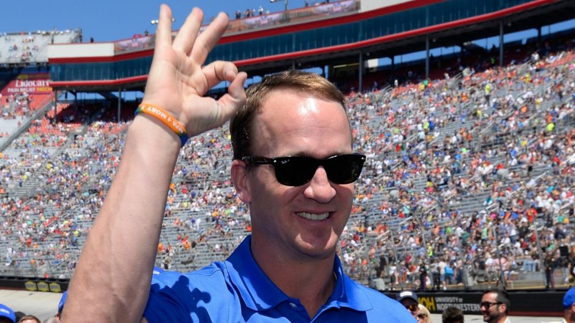 during the NASCAR Sprint Cup Series Food City 500 at Bristol Motor Speedway on April 17, 2016 in Bristol, Tennessee.,BRISTOL, TN - APRIL 17: Former NFL quarterback, Peyton Manning stands on the grid prior to the NASCAR Sprint Cup Series Food City 500 at Bristol Motor Speedway on April 17, 2016 in Bristol, Tennessee. (Photo by Robert Laberge/Getty Images)