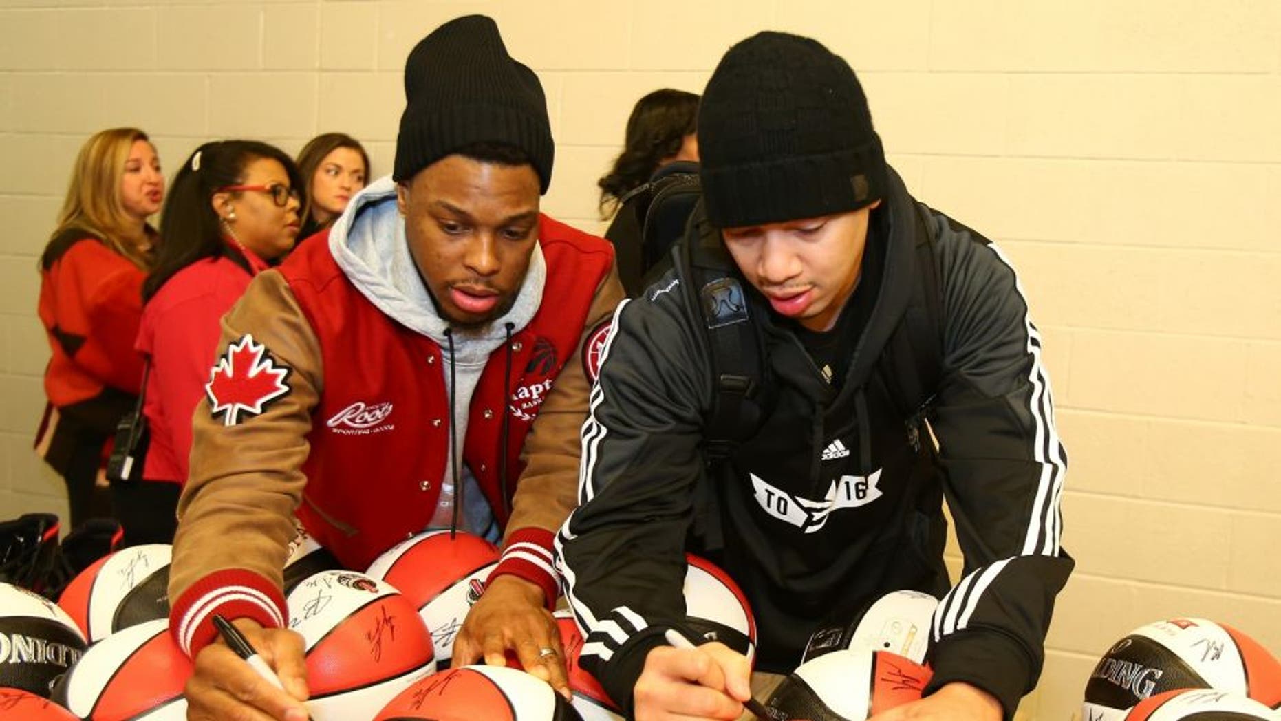 TORONTO, CANADA - FEBRUARY 13: Kyle Lowry #7 and Tyronn Lue of the Eastern Conference All-Stars autographs balls before the NBA All-Star Practice as part of 2016 All-Star Weekend at the Ricoh Coliseum on February 13, 2016 in Toronto, Ontario, Canada. NOTE TO USER: User expressly acknowledges and agrees that, by downloading and/or using this photograph, user is consenting to the terms and conditions of the Getty Images License Agreement. Mandatory Copyright Notice: Copyright 2016 NBAE (Photo by Nathaniel S. Butler/NBAE via Getty Images)