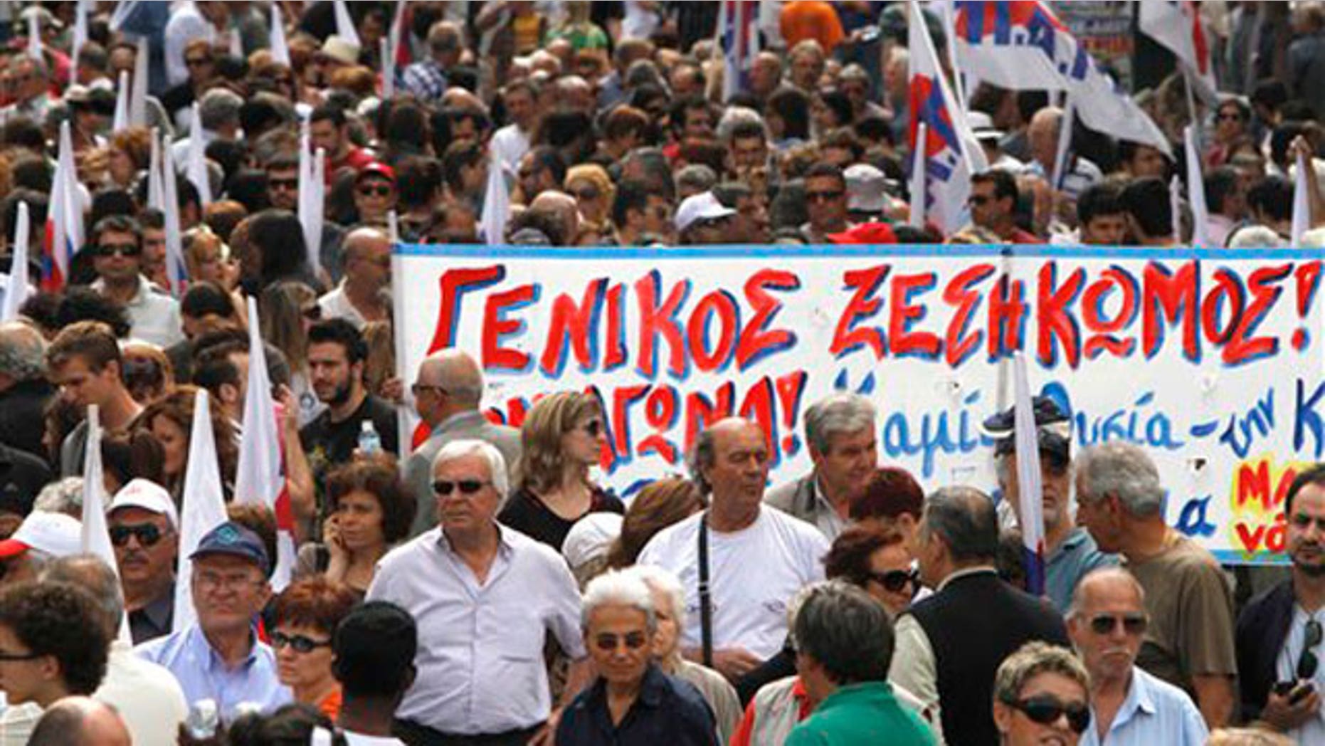 May 20: Demonstrators hold a banner which reads in Greek "General uprising'' during a march organized by a Communist-backed labor union, in central Athens.