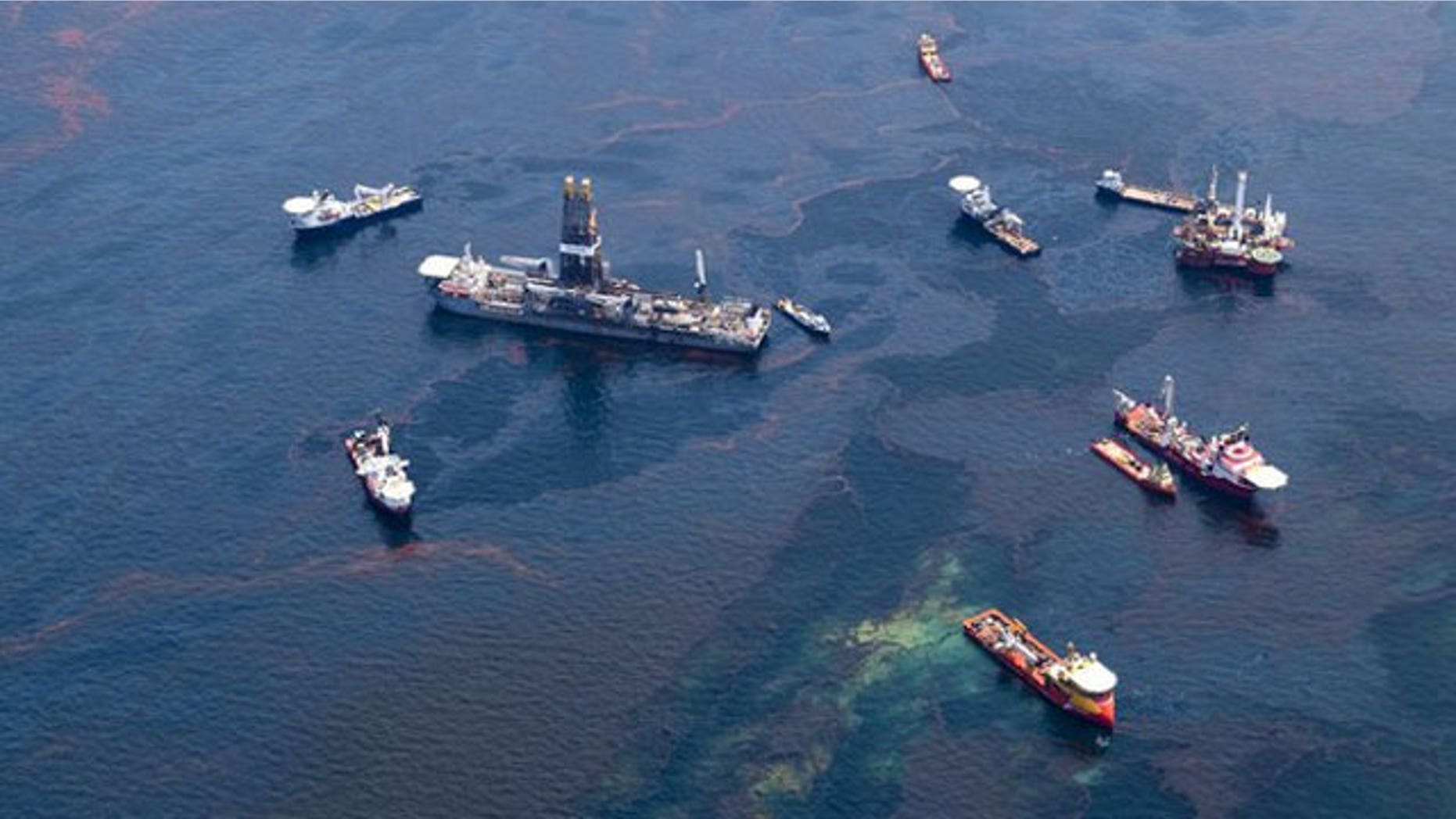 May 18: Ships make their way through surface oil near a barge funnelling off oil from the Deepwater Horizon wellhead in this aerial view over the Gulf of Mexico. Fears that ocean currents were spreading oil from the Gulf of Mexico spill flared on Tuesday after tar balls turned up in Florida, raising pressure on energy giant BP to capture more of the leaking crude (Reuters).