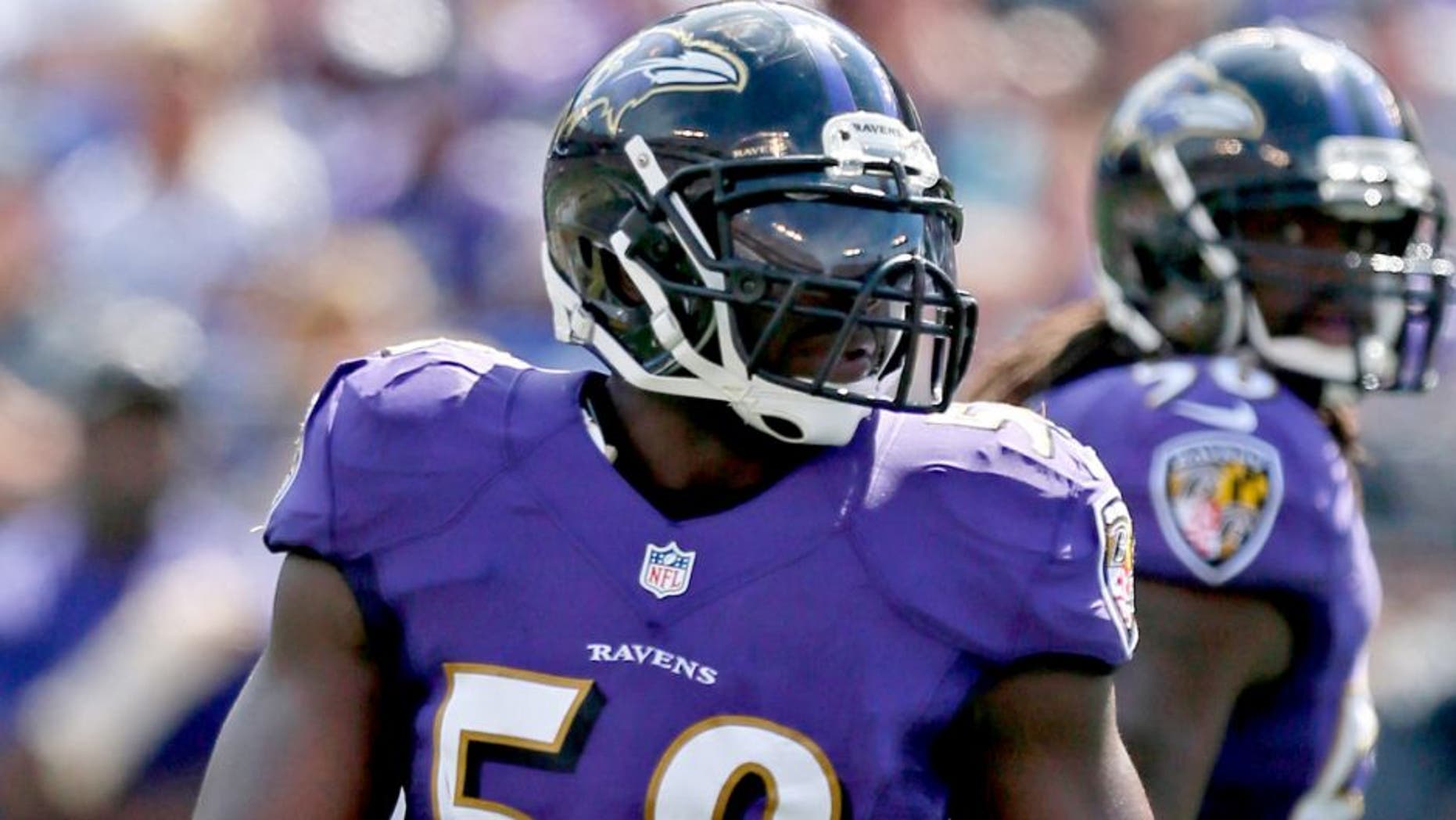 Sep 15, 2013; Baltimore, MD, USA; Baltimore Ravens linebacker Elvis Dumervil (58) during the game against the Cleveland Browns at M&T Bank Stadium. Mandatory Credit: Mitch Stringer-USA TODAY Sports