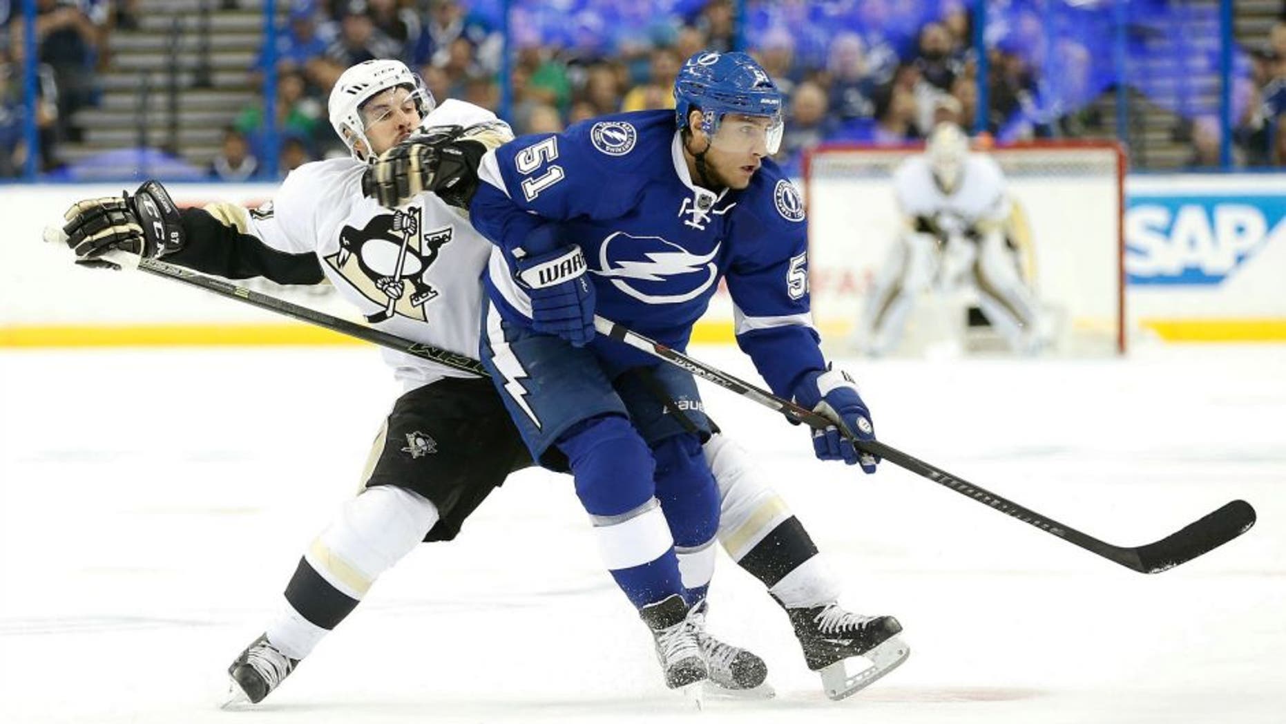 May 20, 2016; Tampa, FL, USA; Pittsburgh Penguins center Sidney Crosby (87) and Tampa Bay Lightning center Valtteri Filppula (51) fight to control the puck during the second period of game four of the Eastern Conference Final of the 2016 Stanley Cup Playoffs at Amalie Arena. Mandatory Credit: Kim Klement-USA TODAY Sports