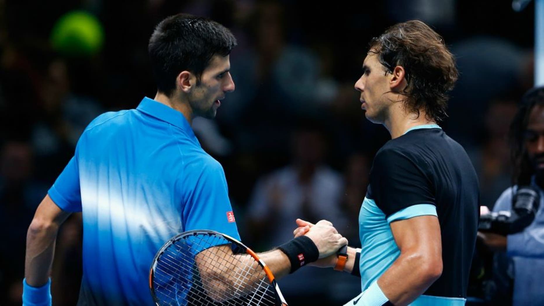 during the Barclays ATP World Tour Finals on Day Seven at O2 Arena on November 21, 2015 in London, England.,LONDON, ENGLAND - NOVEMBER 21: Novak Djokovic of Serbia is congratulated by Rafael Nadal of Spain in the semi final during the Barclays ATP World Tour Finals on Day Seven at O2 Arena on November 21, 2015 in London, England. (Photo by Julian Finney/Getty Images)