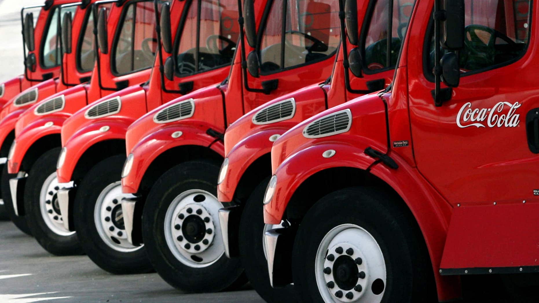 Oct. 26, 2006: Coca-Cola supply trucks park in a distribution center in Caracas.