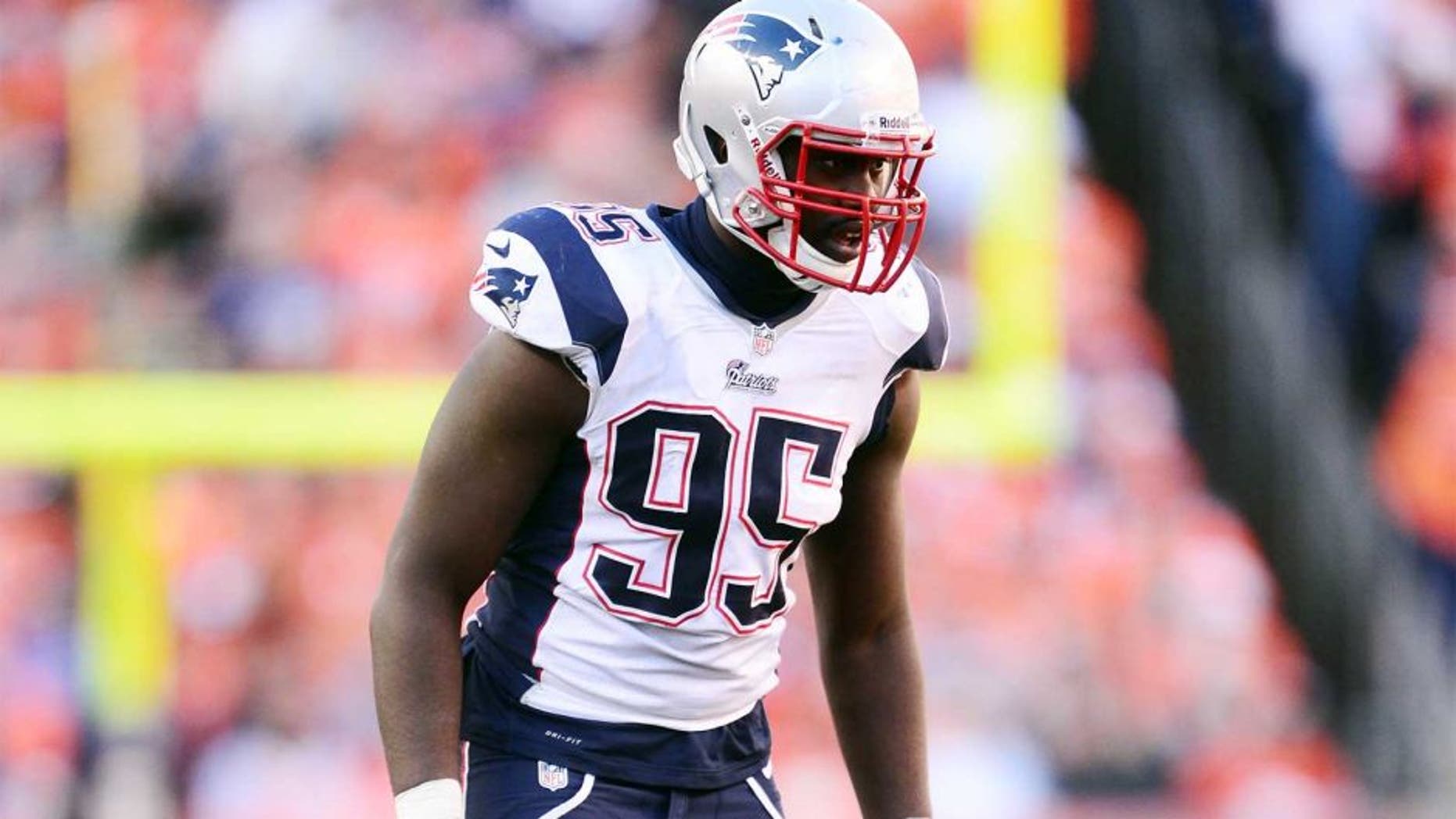 January 19, 2014; Denver, CO, USA; New England Patriots defensive end Chandler Jones (95) in the first of the game against the Denver Broncos of the 2013 AFC Championship football game at Sports Authority Field at Mile High. Mandatory Credit: Ron Chenoy-USA TODAY Sports