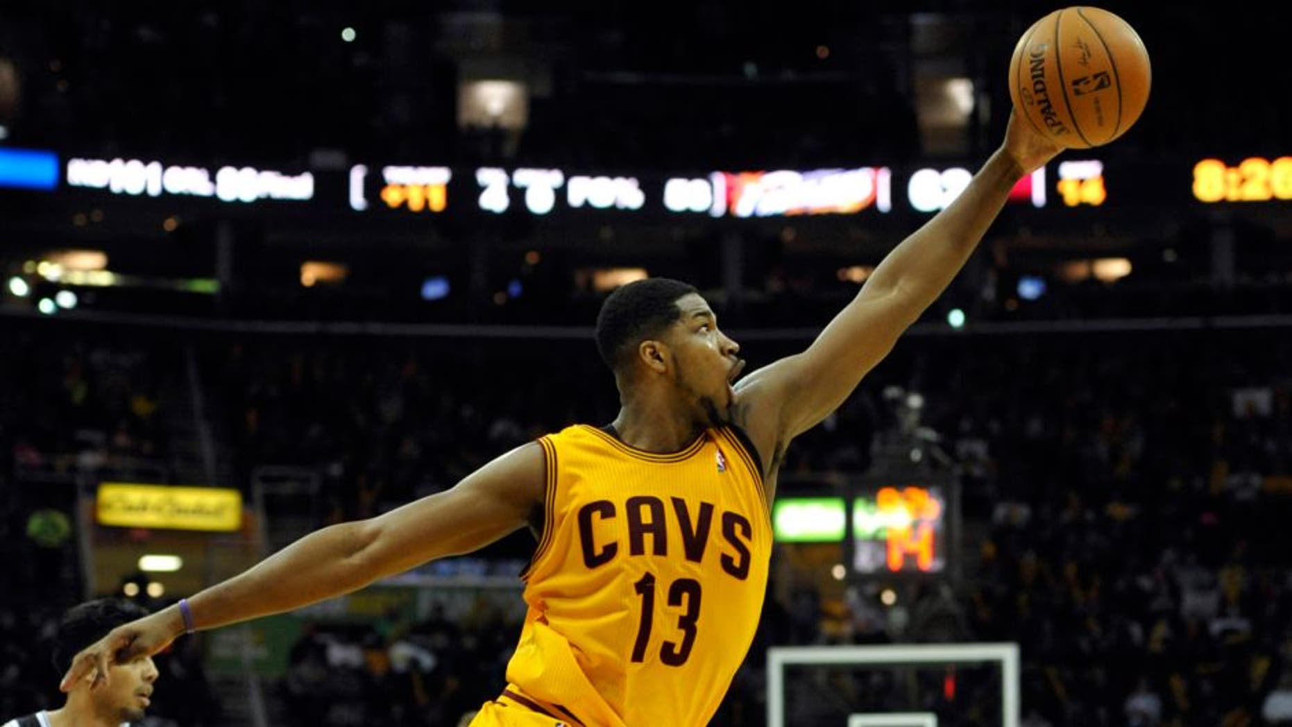 Apr 12, 2014; Cleveland, OH, USA; Cleveland Cavaliers forward Tristan Thompson (13) reaches for a loose ball in the third quarter against the Brooklyn Nets at Quicken Loans Arena. Mandatory Credit: David Richard-USA TODAY Sports