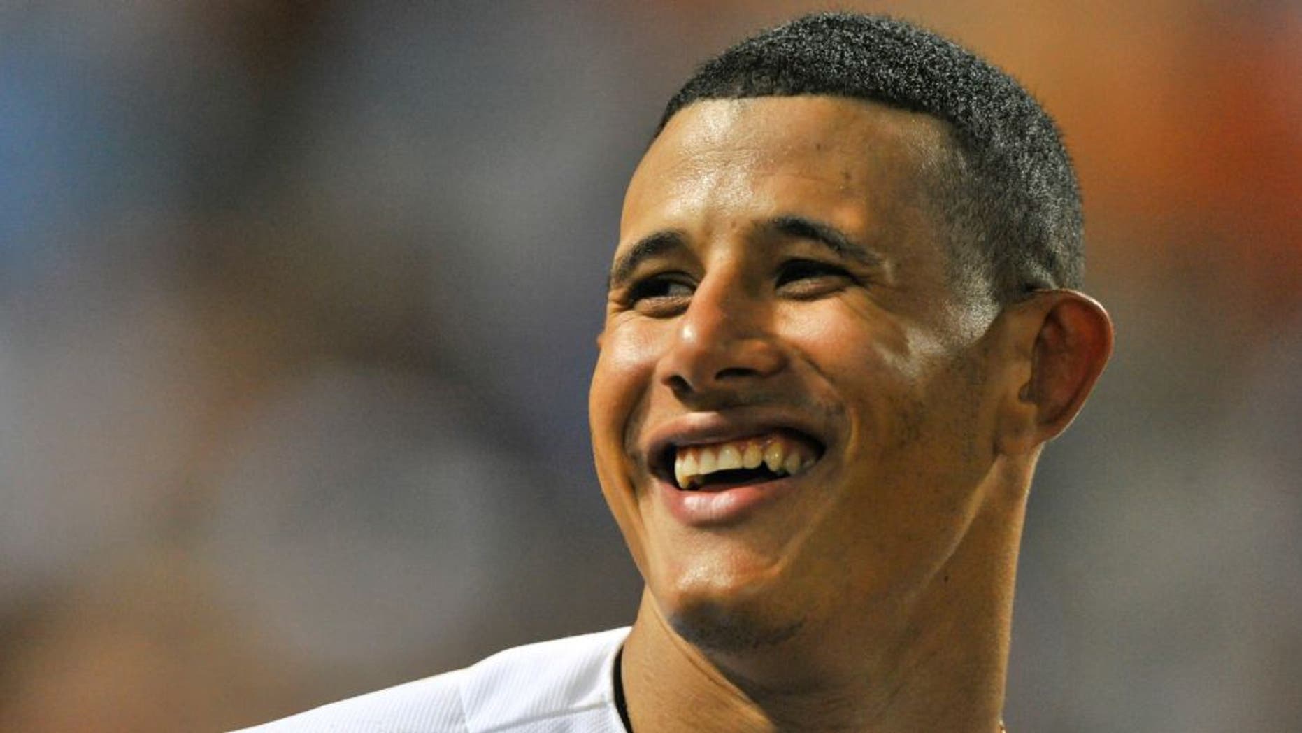 May 19, 2015; Baltimore, MD, USA; Baltimore Orioles third baseman Manny Machado (13) stands at the top of the dugout during the seventh inning against the Seattle Mariners at Oriole Park at Camden Yards. Baltimore Orioles defeat Seattle Mariners 9-4. Mandatory Credit: Tommy Gilligan-USA TODAY Sports