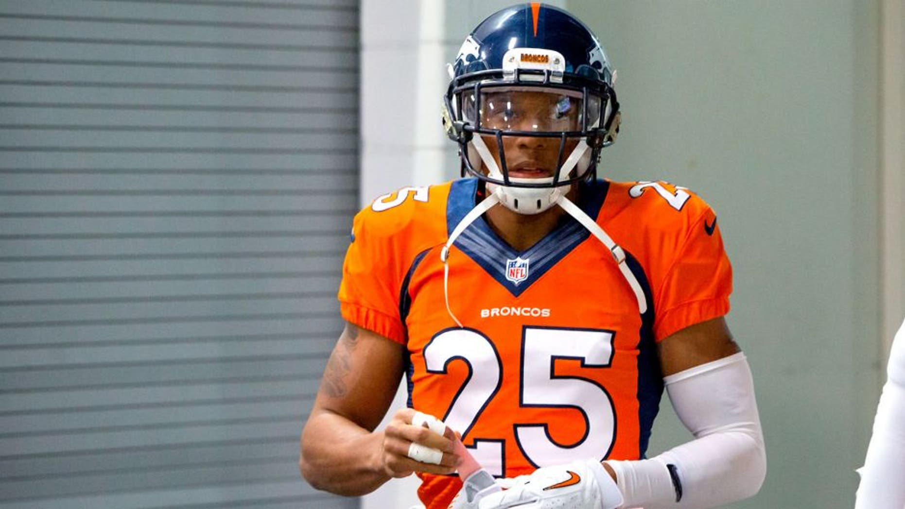 Jan 11, 2015; Denver, CO, USA; Denver Broncos cornerback Chris Harris Jr. (25) against the Indianapolis Colts in the 2014 AFC Divisional playoff football game at Sports Authority Field at Mile High. The Colts defeated the Broncos 24-13. Mandatory Credit: Mark J. Rebilas-USA TODAY Sports
