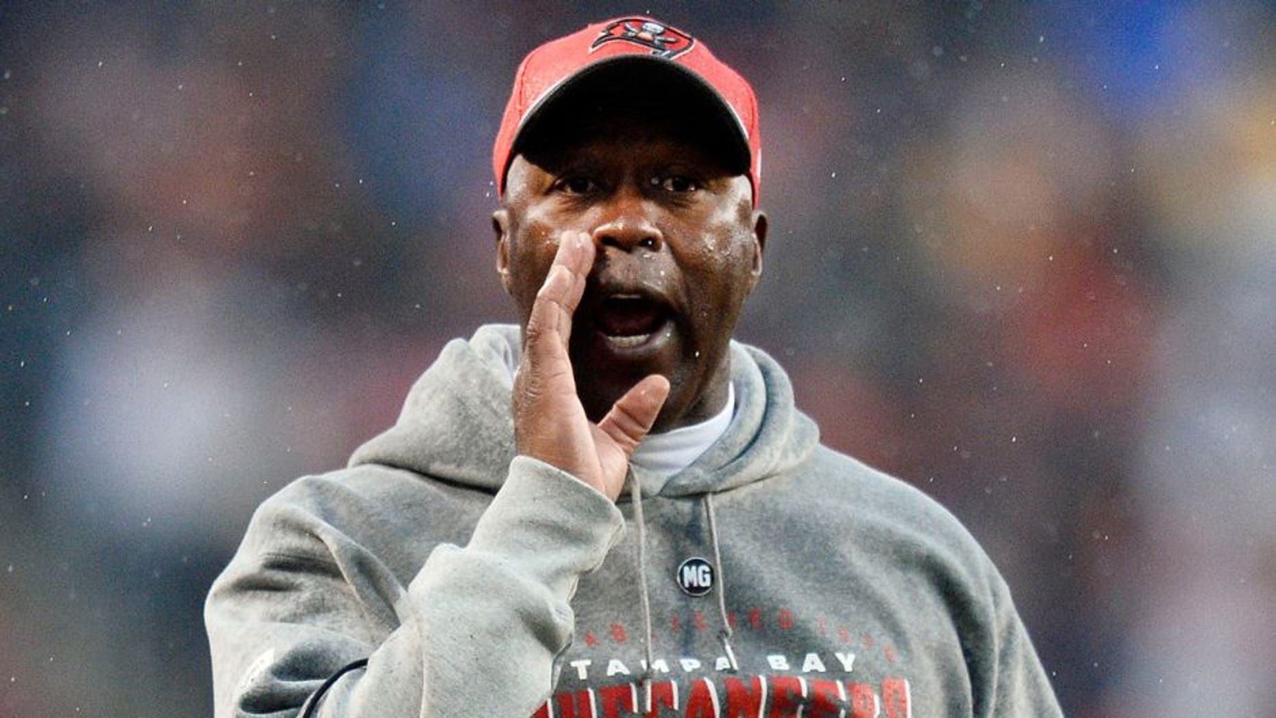 CHICAGO, IL - NOVEMBER 23: Head coach Lovie Smith of the Tampa Bay Buccaneers yells during the fourth quarter against the Chicago Bears on November 23, 2014 at Soldier Field in Chicago, Illinois. The Bears defeated the Buccaneers 21-13. (Photo by Brian Kersey/Getty Images)