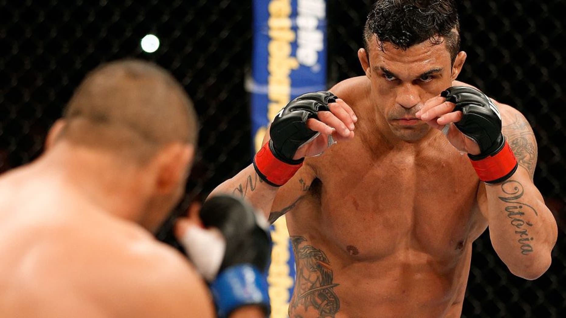 GOIANIA, BRAZIL - NOVEMBER 09: (R-L) Vitor Belfort squares off with Dan Henderson in their light heavyweight bout during the UFC event at Arena Goiania on November 9, 2013 in Goiania, Brazil. (Photo by Josh Hedges/Zuffa LLC/Zuffa LLC via Getty Images)
