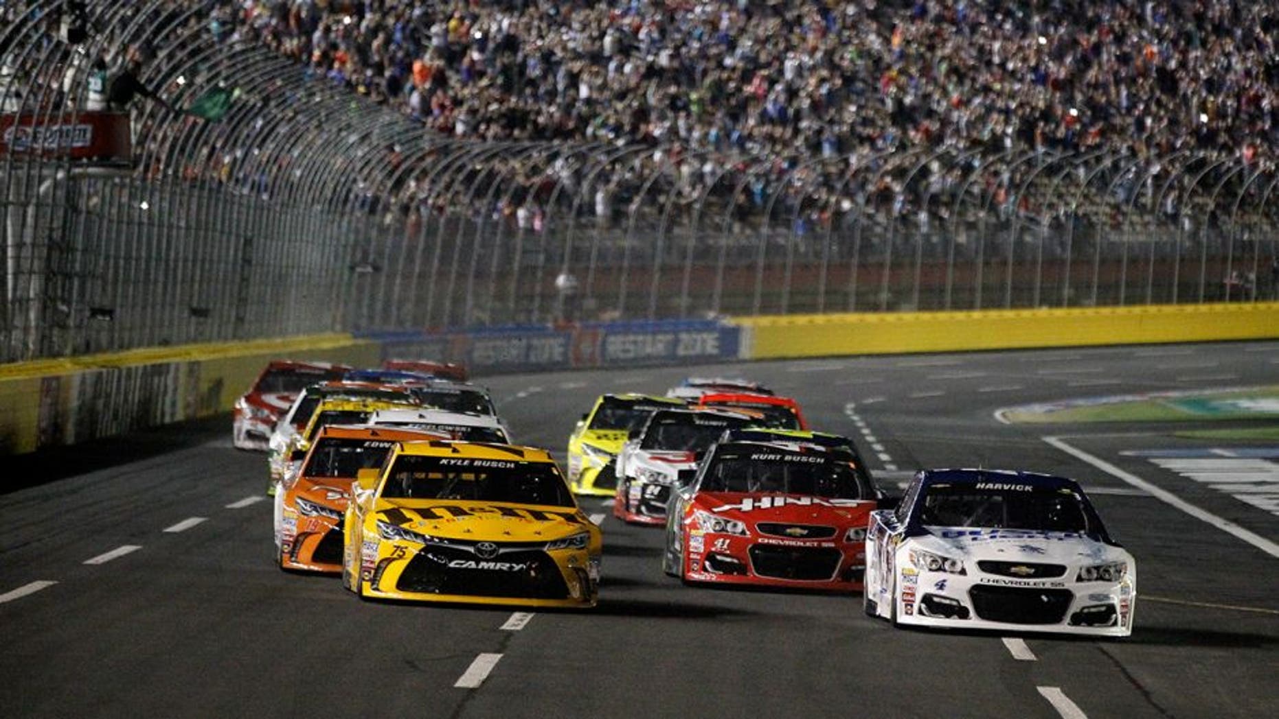 CHARLOTTE, NC - MAY 21: Kevin Harvick, driver of the #4 Busch Light Chevrolet, and Kyle Busch, driver of the #75 M&M's 75th Anniversary Toyota, lead the field past the green flag to start the NASCAR Sprint Cup Series Sprint All-Star Race at Charlotte Motor Speedway on May 21, 2016 in Charlotte, North Carolina. (Photo by Brian Lawdermilk/Getty Images)