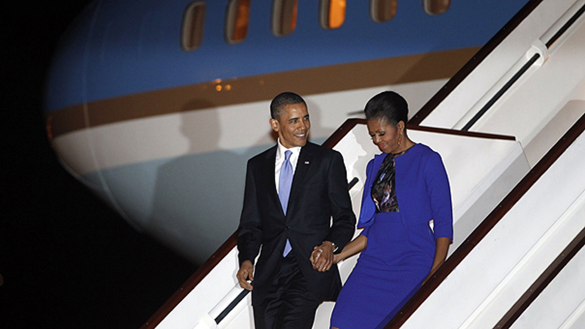 May 23: President Barack Obama and first lady Michelle Obama step off Air Force One as they arrive at London's Stansted Airport.