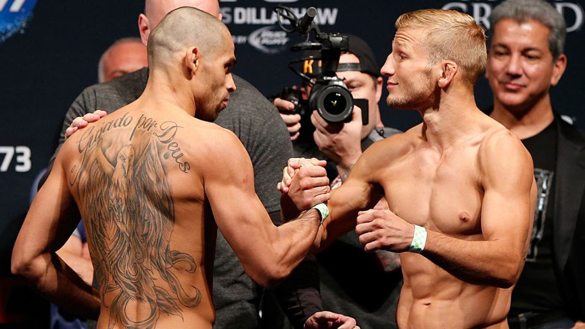 LAS VEGAS, NV - MAY 23: (L-R) Opponents Renan Barao and T.J. Dillashaw shake hands during the UFC 173 weigh-in at the MGM Grand Garden Arenaon May 23, 2014 in Las Vegas, Nevada. (Photo by Josh Hedges/Zuffa LLC/Zuffa LLC via Getty Images)