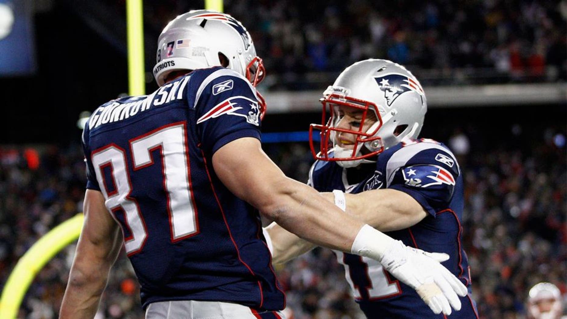 Jan 14, 2012; Foxborough, MA, USA; New England Patriots tight end Rob Gronkowski (87) and wide receiver Julian Edelman (11) celebrate after Gronkowski scored a touchdown against the Denver Broncos during the first half of the 2011 AFC divisional playoff game at Gillette Stadium. Mandatory Credit: Mark L. Baer-USA TODAY Sports