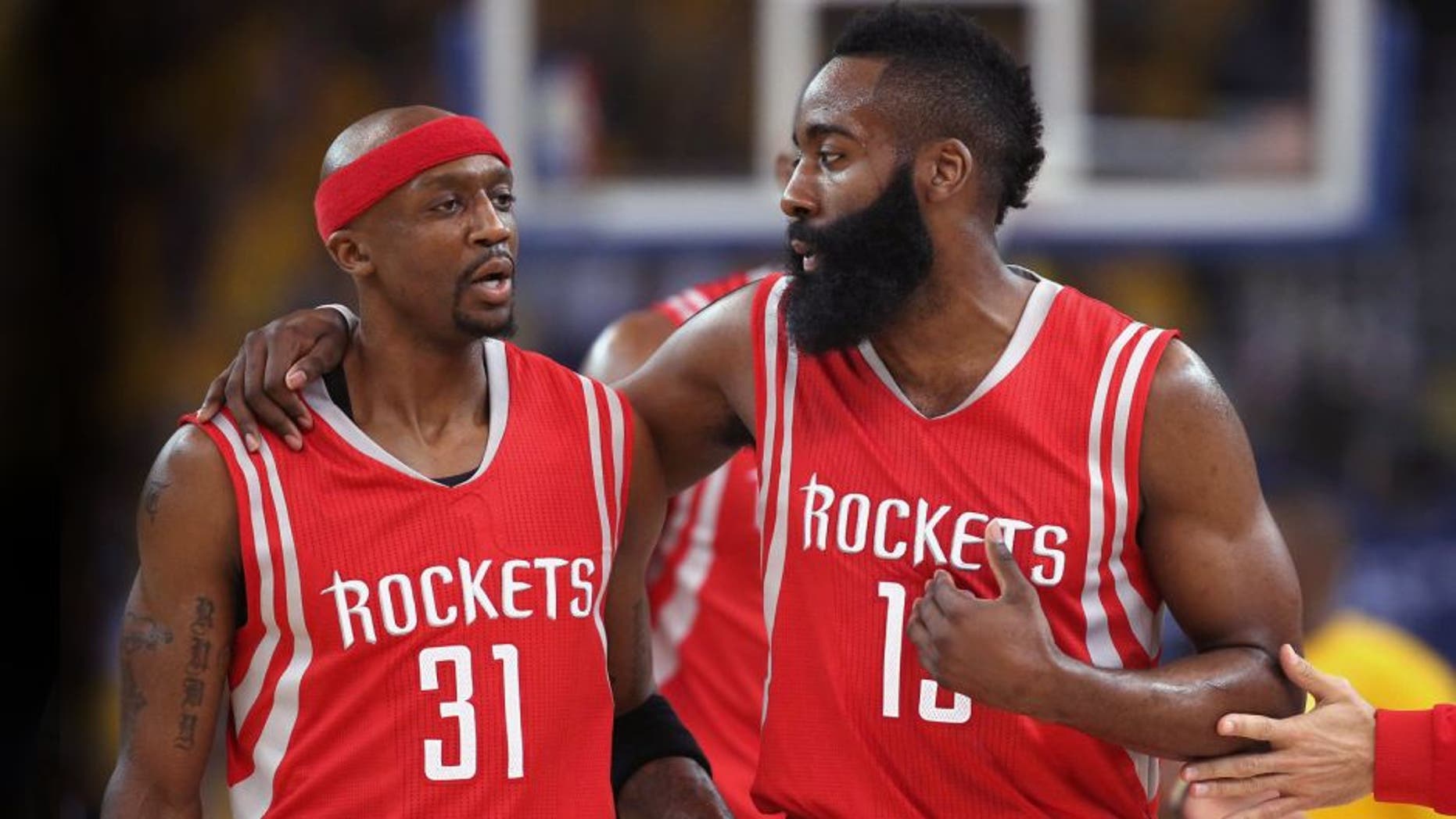 OAKLAND, CA - MAY 21: Jason Terry #31 and James Harden #13 of the Houston Rockets react after a play in the first quarter against the Golden State Warriors during game two of the Western Conference Finals of the 2015 NBA PLayoffs at ORACLE Arena on May 21, 2015 in Oakland, California. NOTE TO USER: User expressly acknowledges and agrees that, by downloading and or using this photograph, user is consenting to the terms and conditions of Getty Images License Agreement. (Photo by Ezra Shaw/Getty Images)
