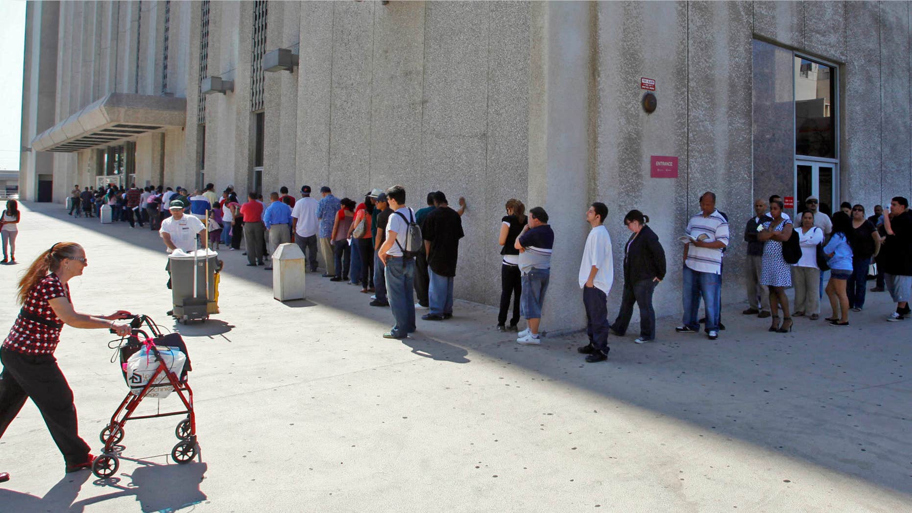 March 18, 2010: People line up outside the Metropolitan Courthouse, which handles traffic citations and other matters, in downtown Los Angeles.
