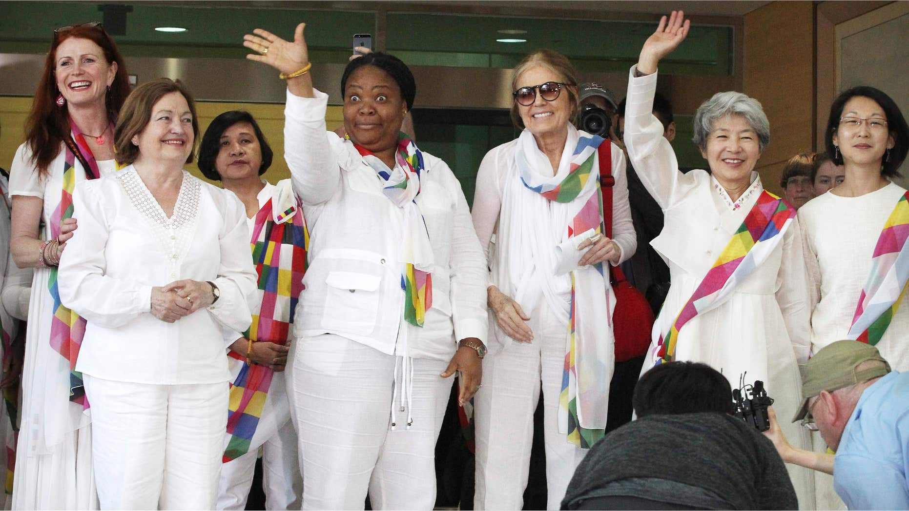 May 24, 2015: From second left, Nobel Peace Prize laureates Mairead Maguire and Leymah Gbowee, U.S. activist Gloria Steinem and other woman activists smile upon their arrival from North Korea at the office of the customs, immigration and quarantine in Paju, South Korea, near the border village of Panmunjom.