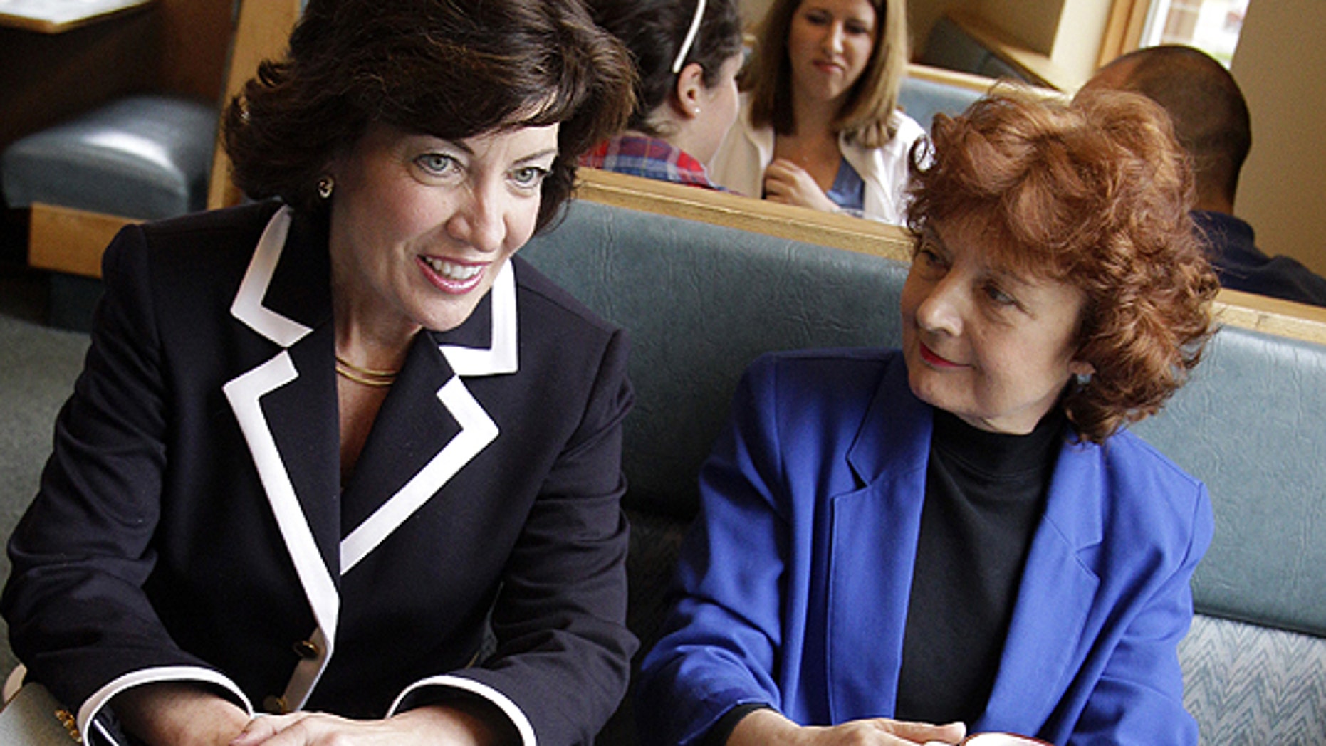 May 24: Democratic candidate for the 26th District Congressional seat, Kathy Hochul, left, talks with Debra Norton, right, and her husband Morrie Newman during a campaign stop at a restaurant in Amherst, N.Y.