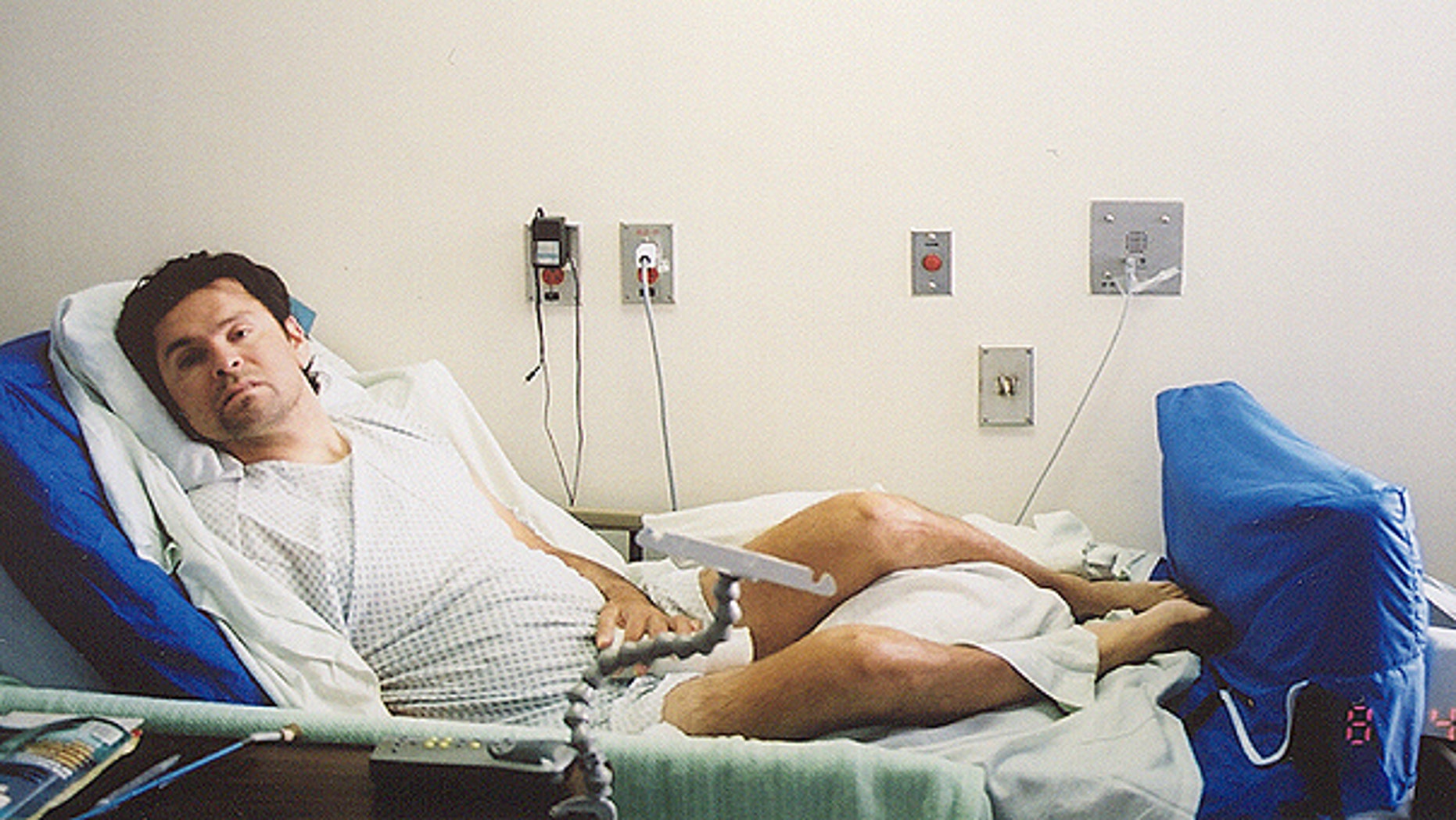 This photo provided by Norma Martinez, shows Steven Martinez in his prison hospital bed at Corcoran State Prison in Corcoran, Calif.